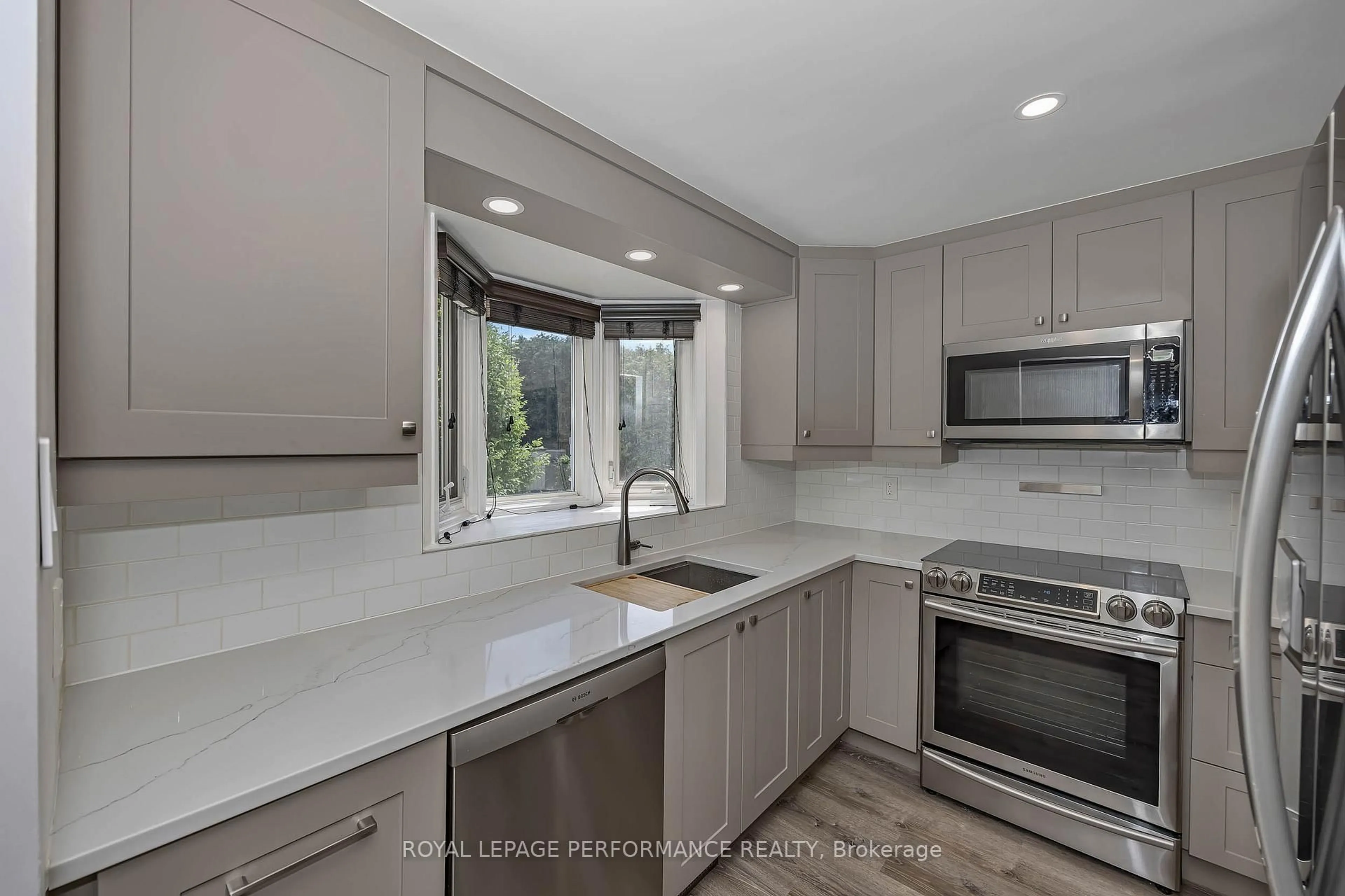 Open concept kitchen, ceramic/tile floor for 1780 Lamoureux Dr #A, Ottawa Ontario K1E 2N4