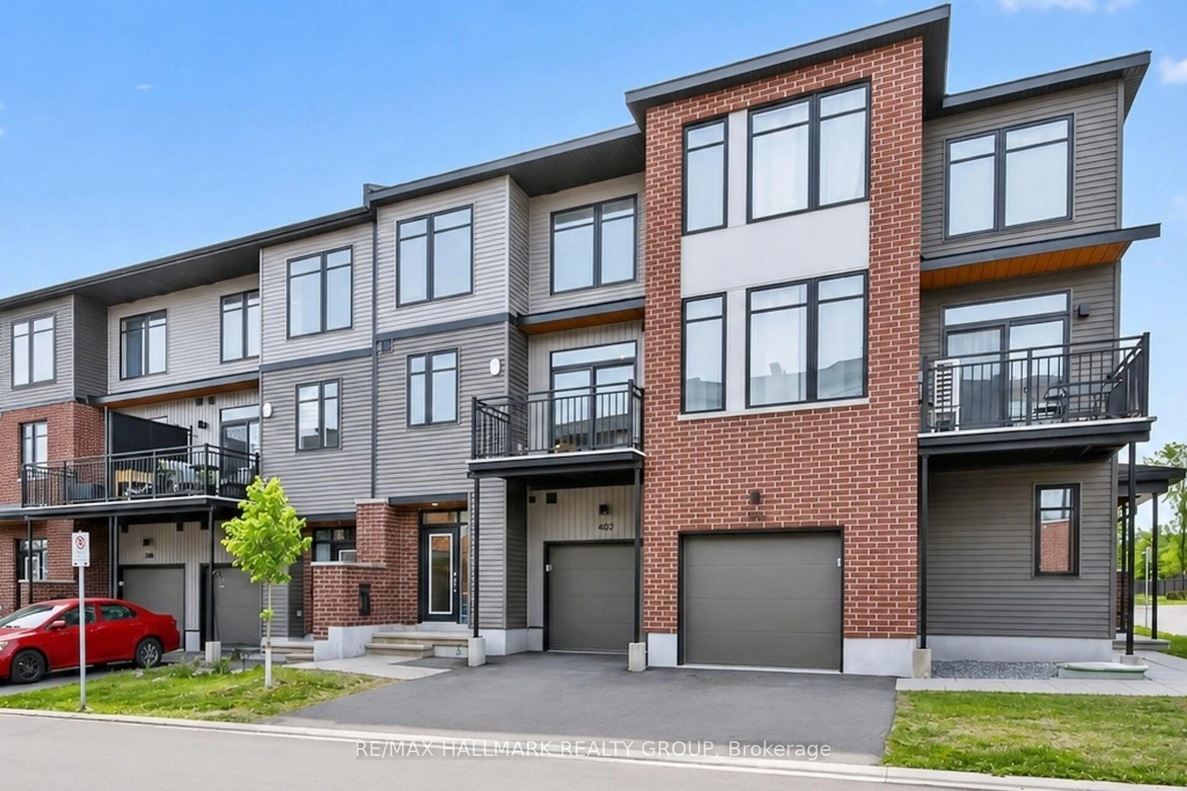 Home with brick exterior material, street for 402 JEWELWING Private, Ottawa Ontario K1X 0M7