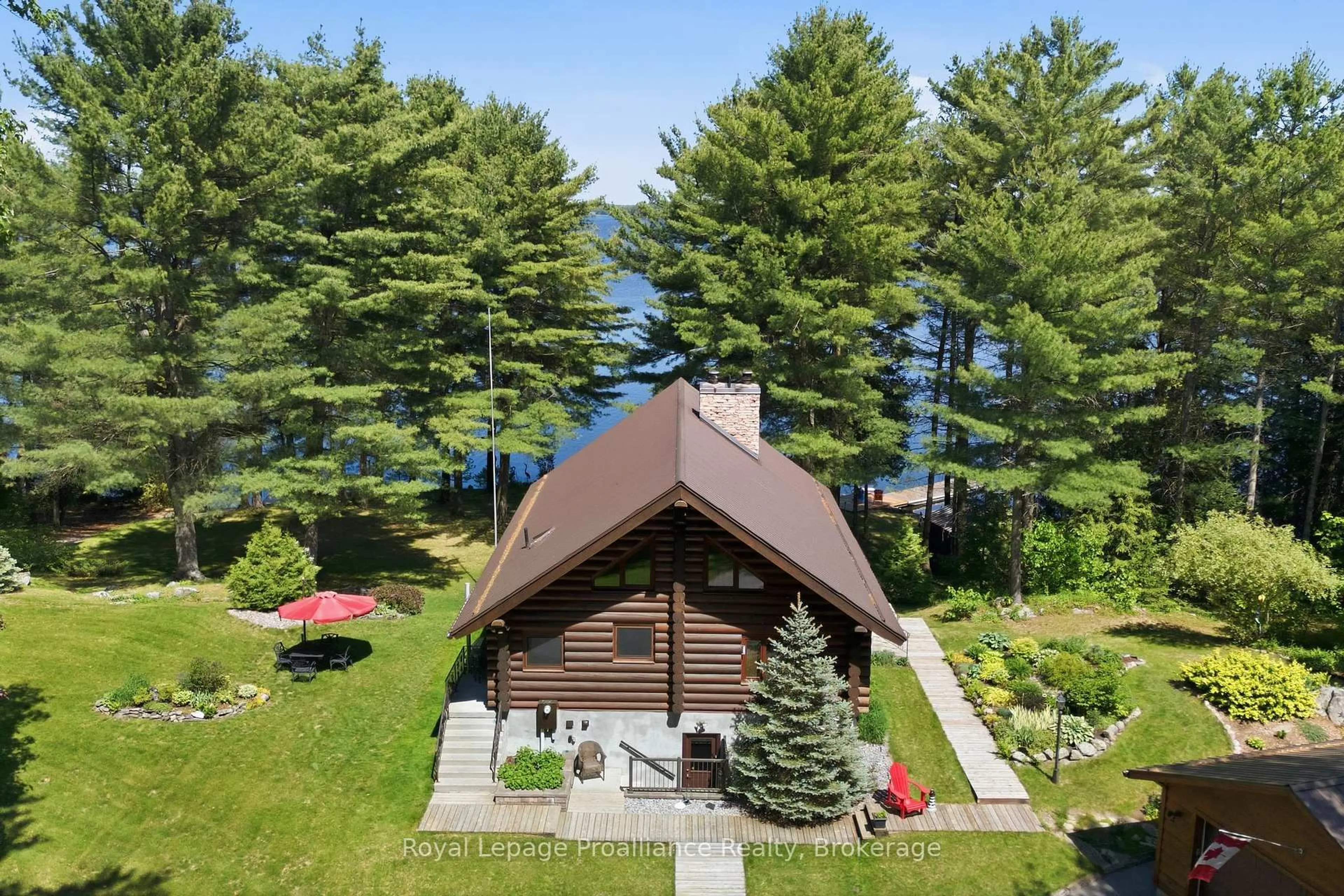 A pic from outside/outdoor area/front of a property/back of a property/a pic from drone, water/lake/river/ocean view for 1435 Whites Rd, Arden Ontario K0H 1B0