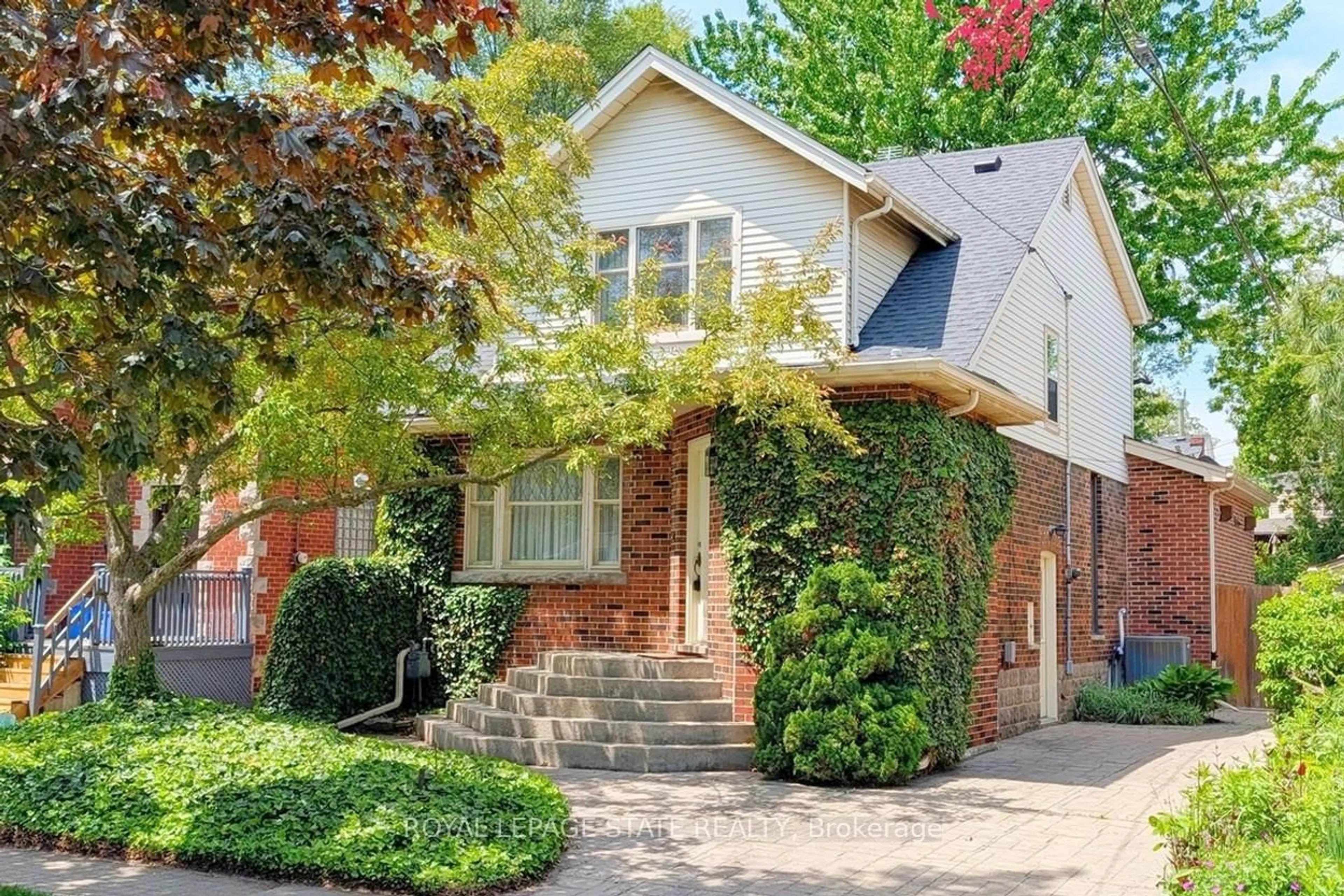 Home with brick exterior material, street for 12 Bond St, Hamilton Ontario L8S 1S7