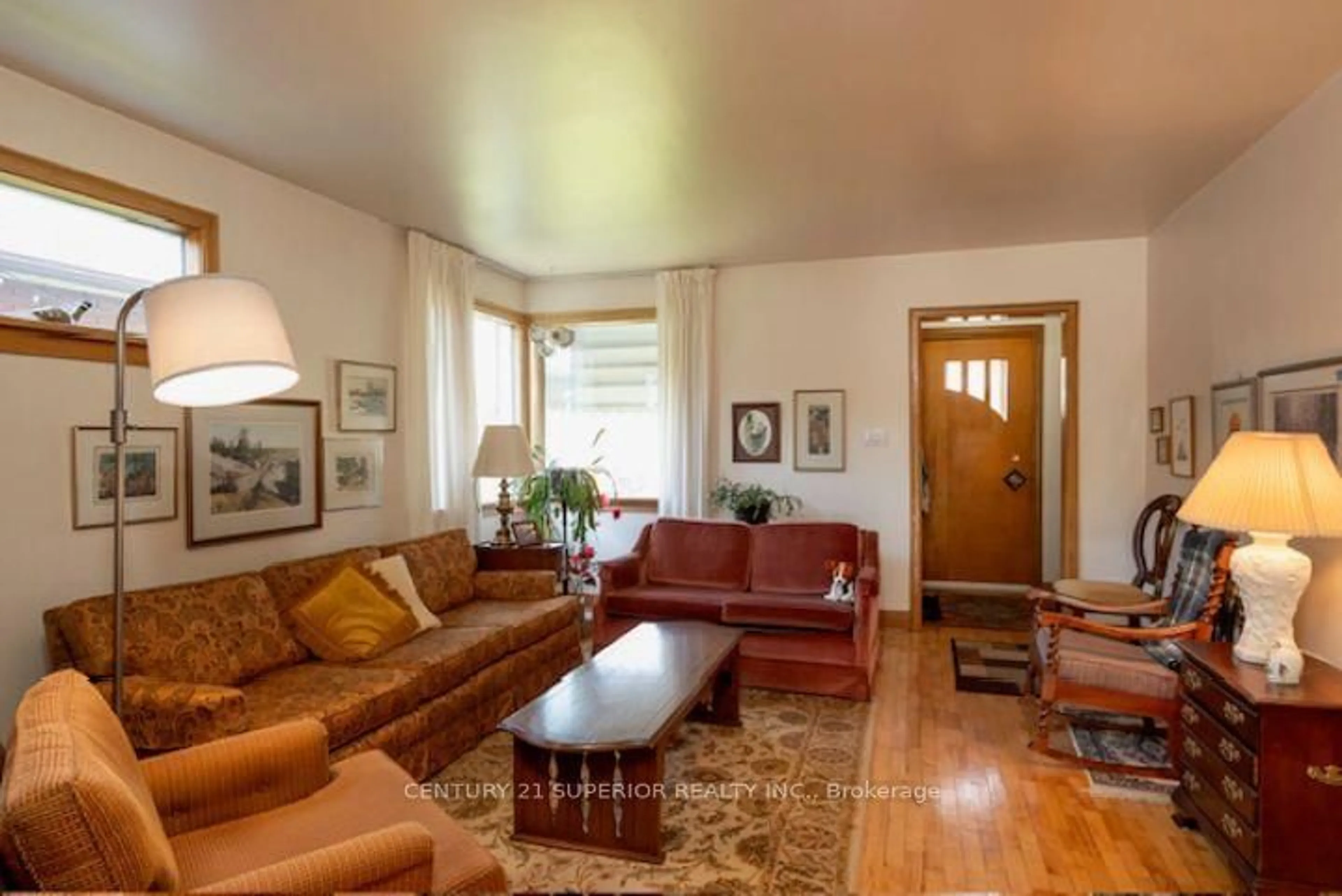 Living room with furniture, wood/laminate floor for 834 Syndicate Ave, Thunder Bay Ontario P7C 3X5