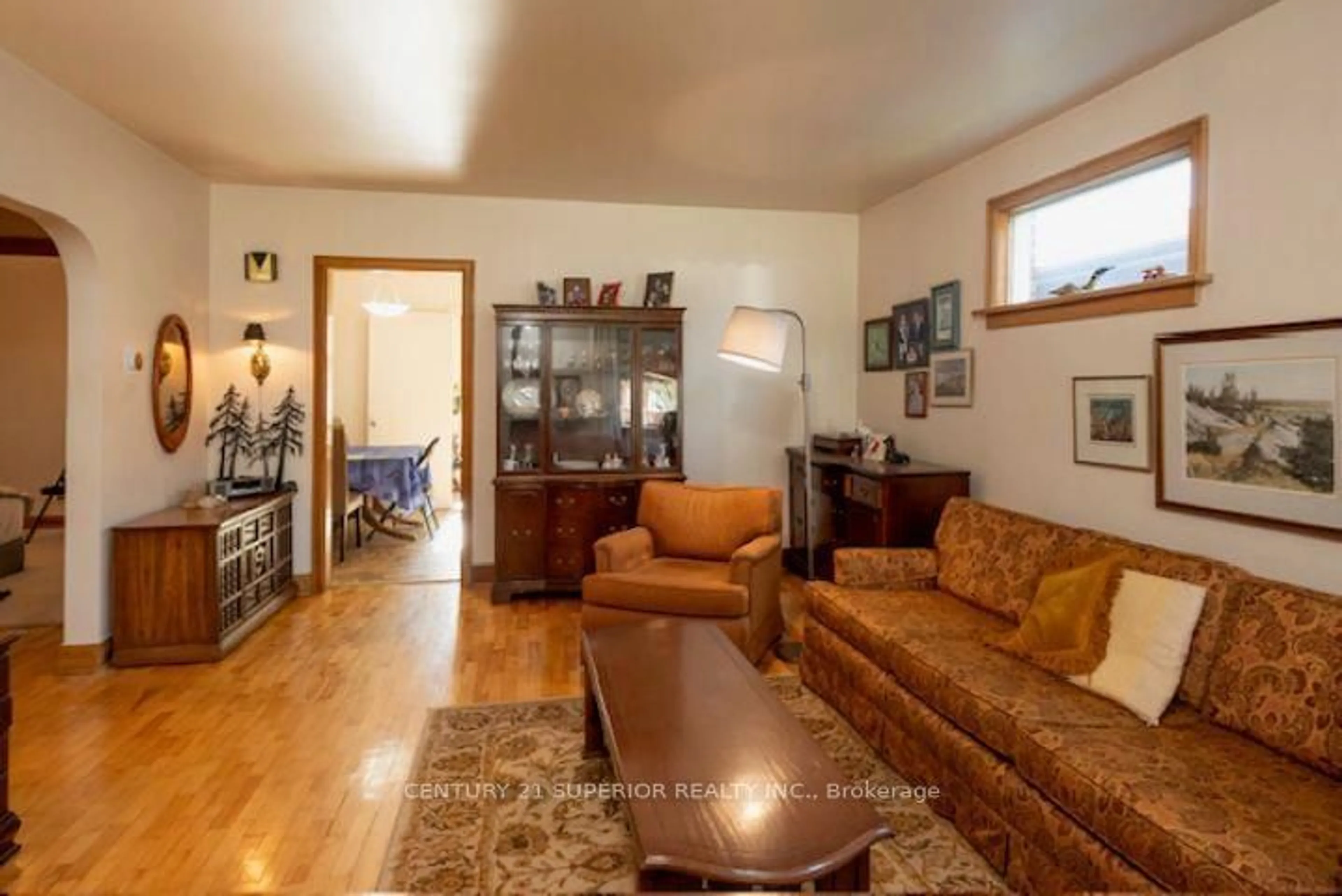 Living room with furniture, wood/laminate floor for 834 Syndicate Ave, Thunder Bay Ontario P7C 3X5