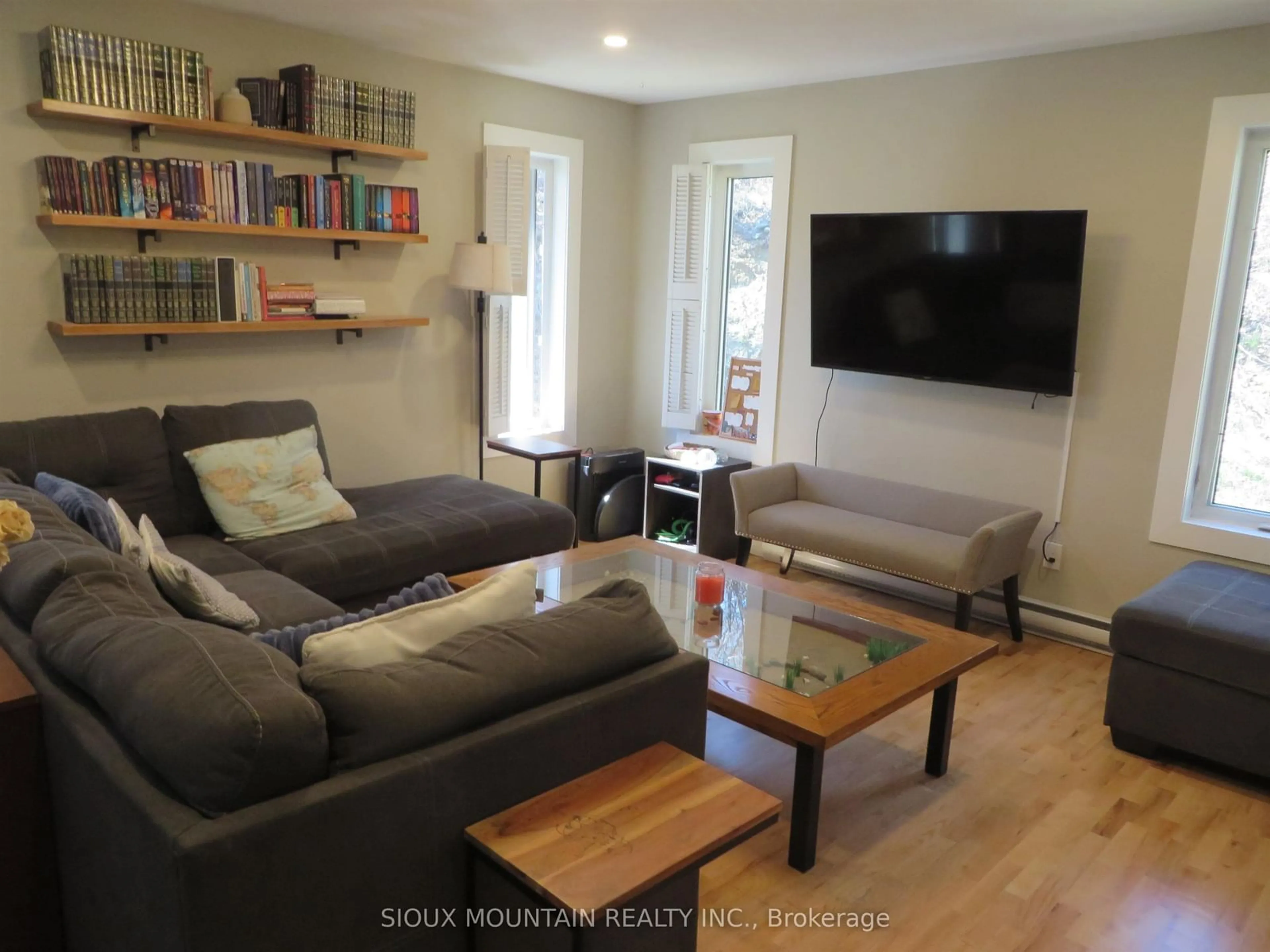 Living room with furniture, wood/laminate floor for 77 Prince Street, Sioux Lookout Ontario P8T 1B3
