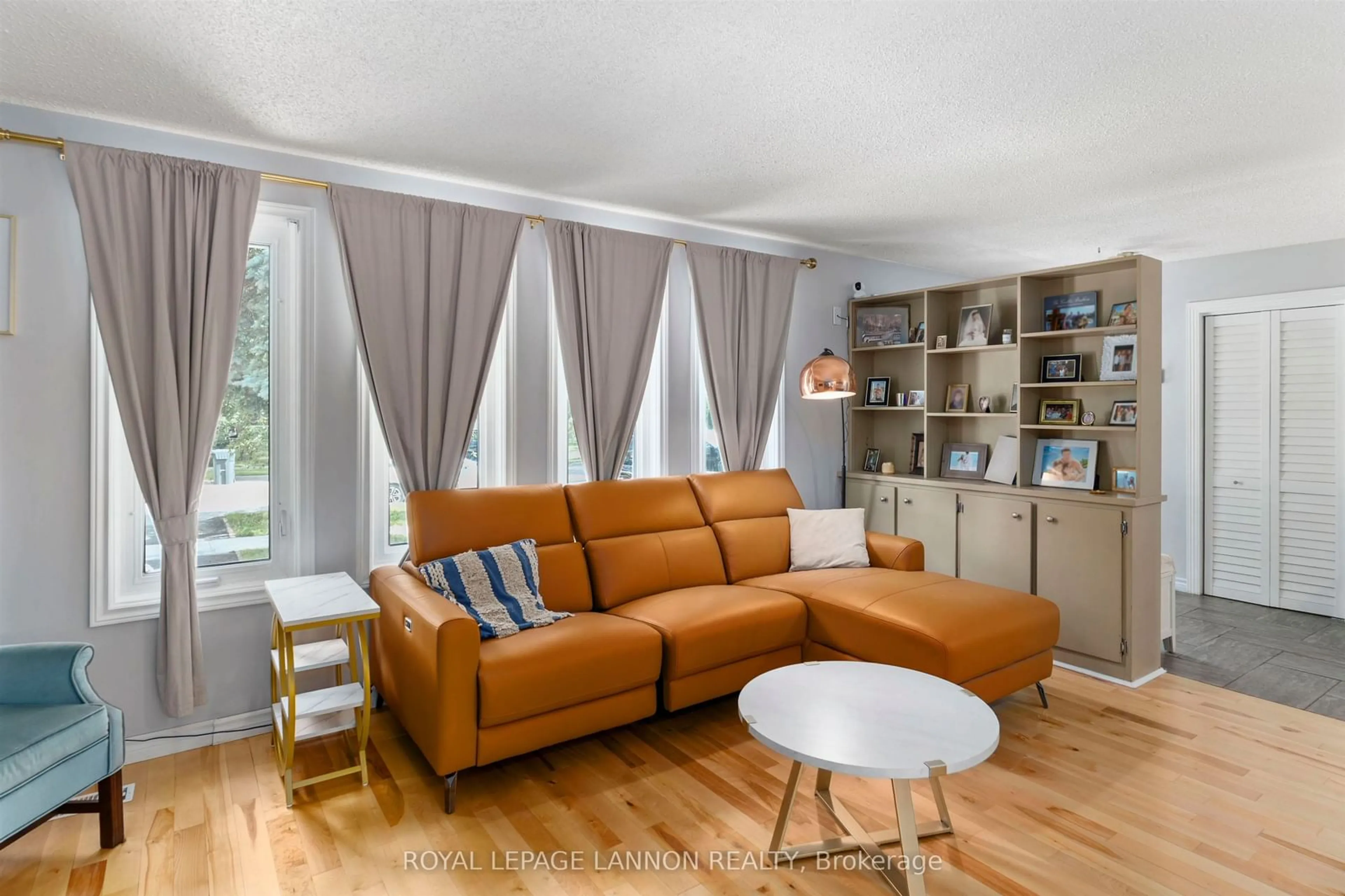 Living room with furniture, wood/laminate floor for 425 Chelsea Cres., Thunder Bay Ontario P7B 5P8