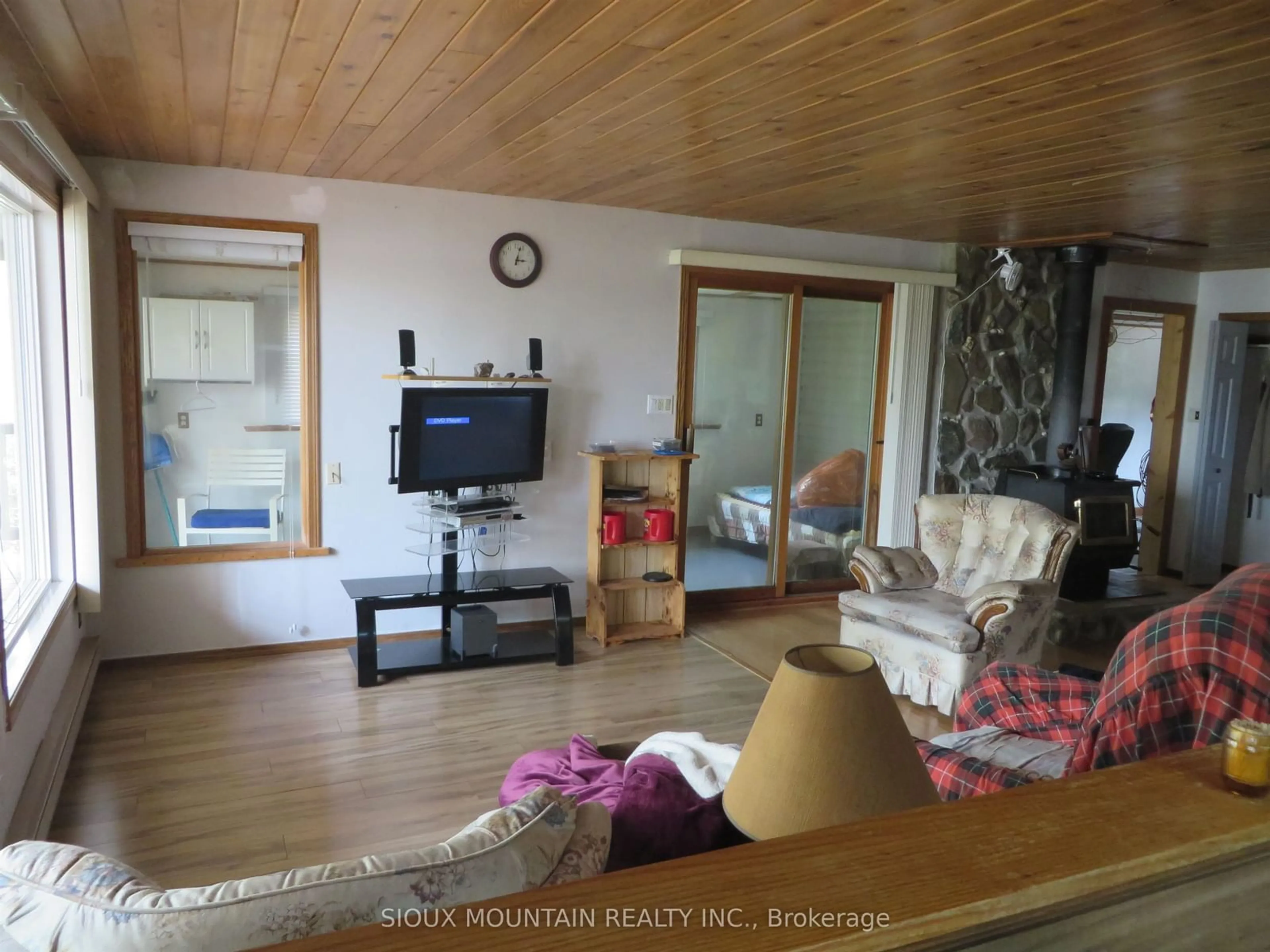 Living room with furniture, wood/laminate floor for 1844 Southshore Drive, Sioux Lookout Ontario P8T 0A7