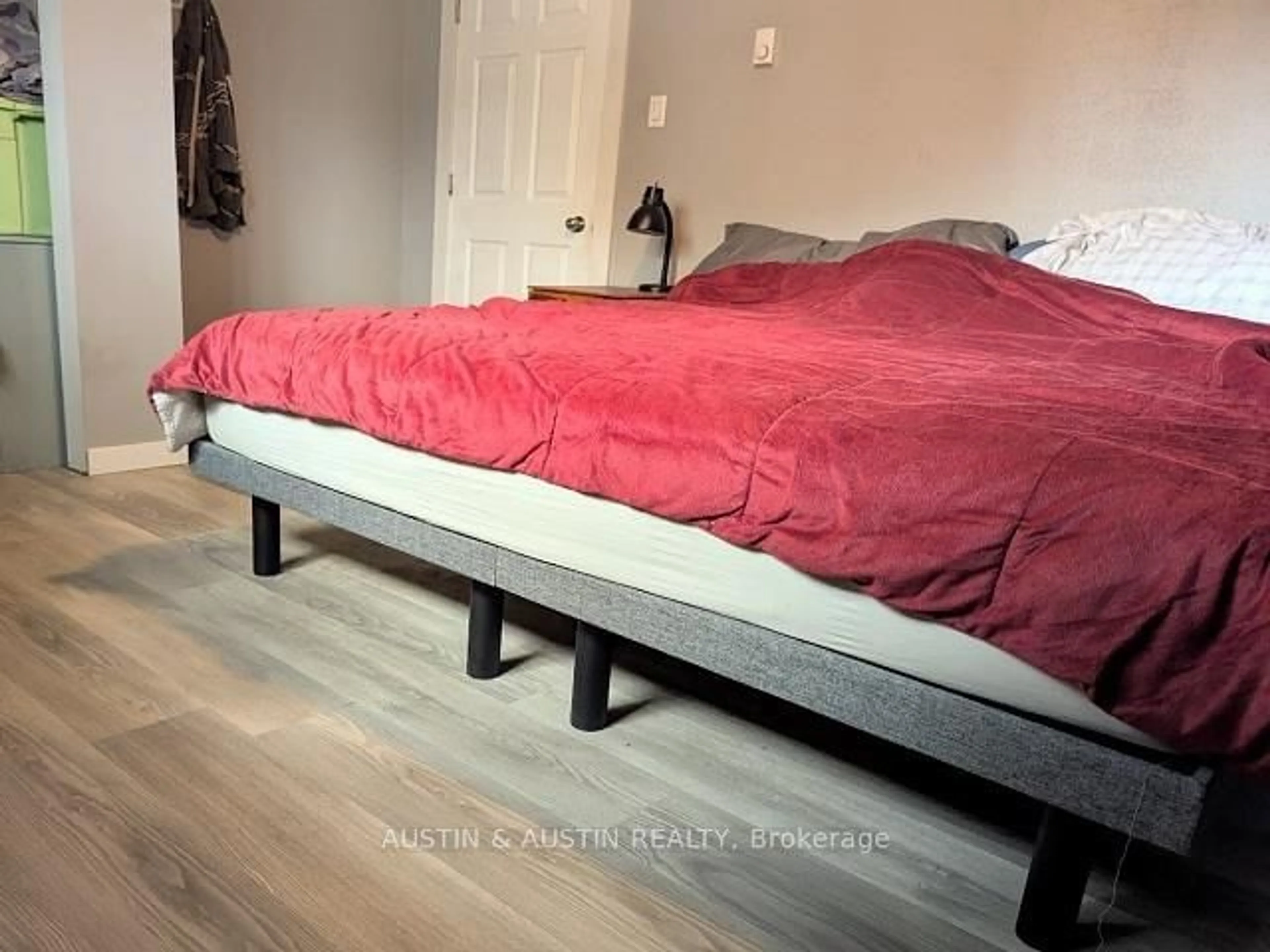 Bedroom with bed, wood/laminate floor for 33 Victoria St, Kenora Remote Area Ontario P0V 2W0