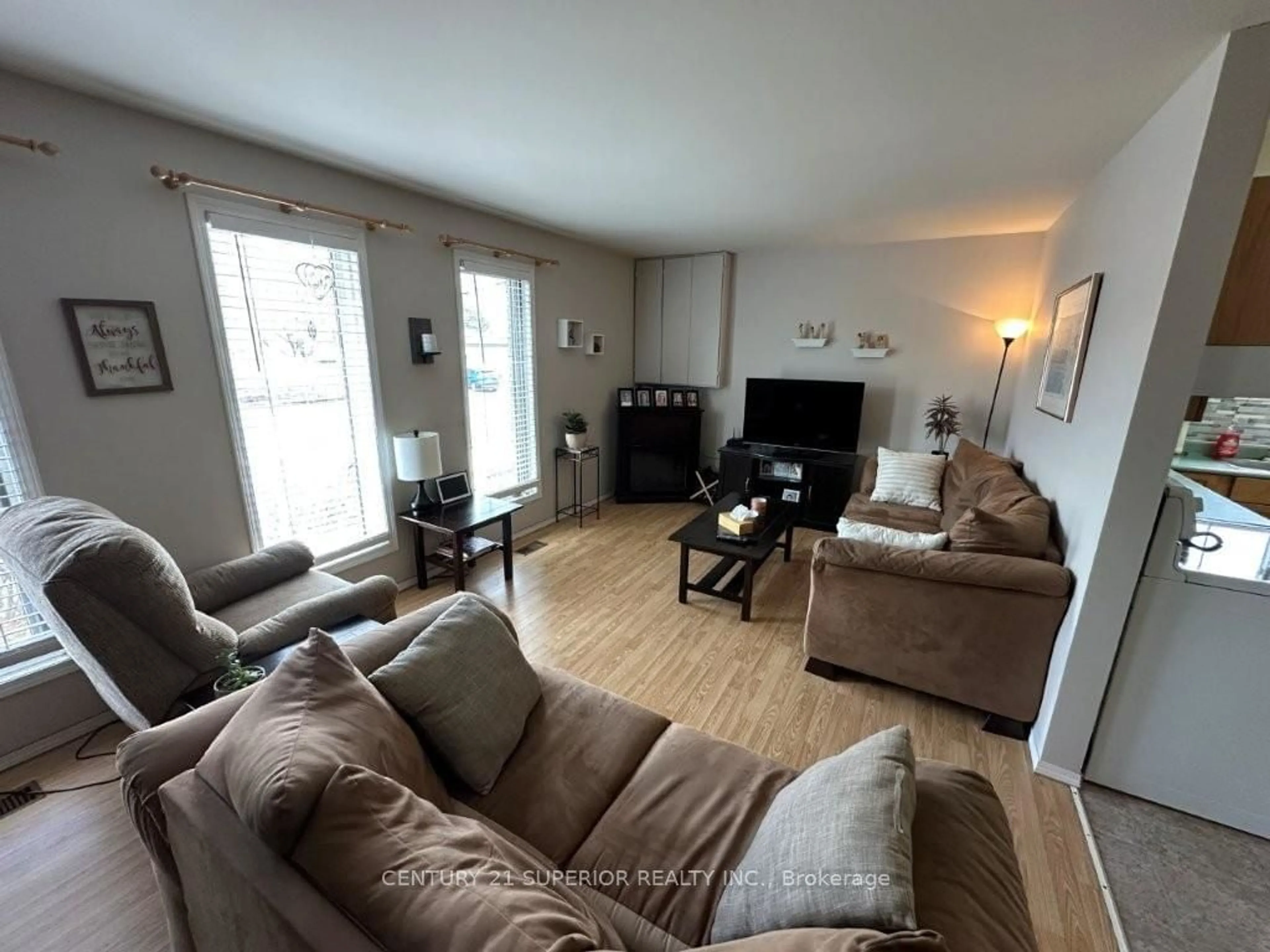 Living room with furniture, wood/laminate floor for 851 & 853 Newport Ave, Thunder Bay Ontario P7A 6K1