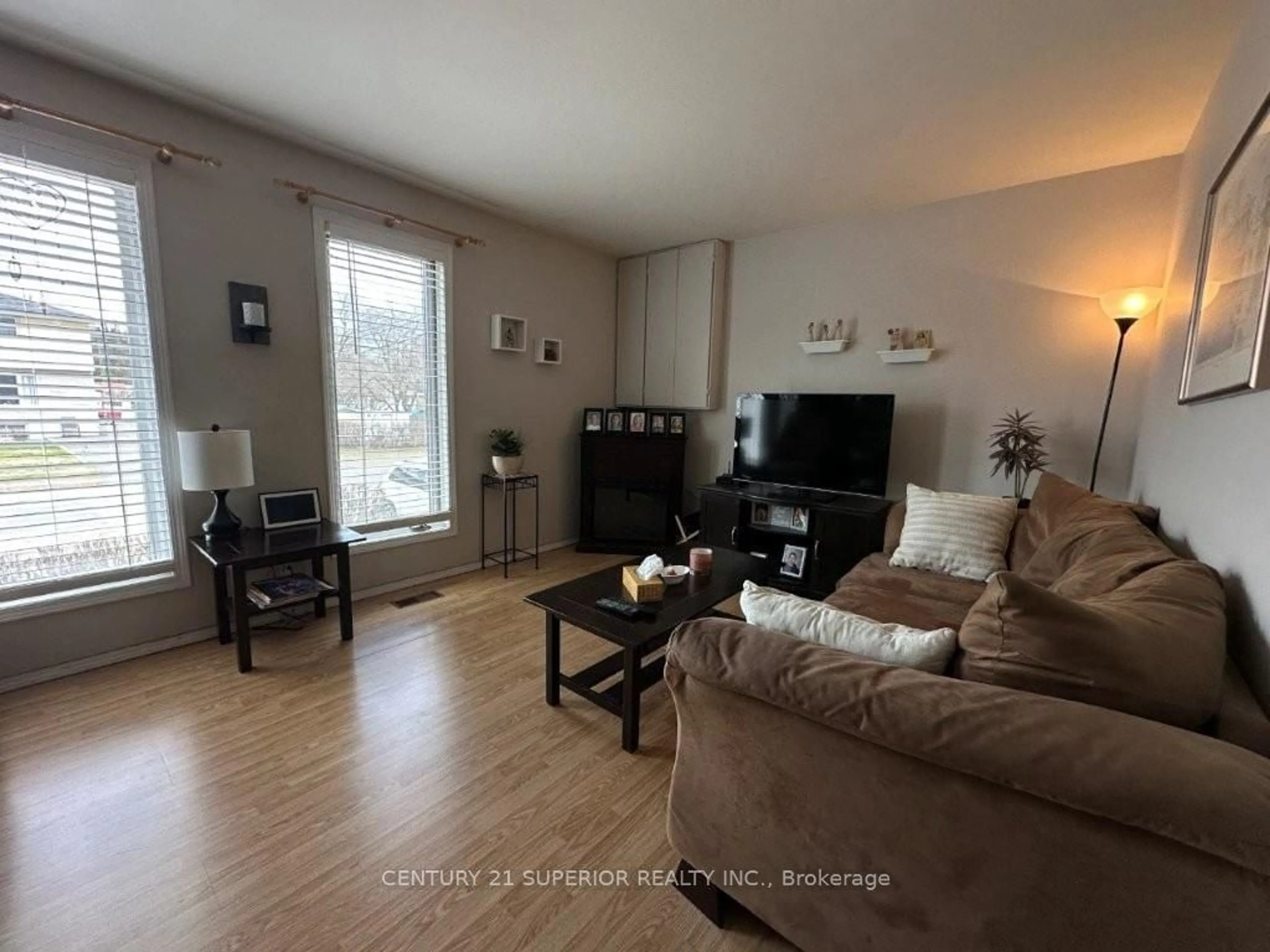 Living room with furniture, wood/laminate floor for 851 & 853 Newport Ave, Thunder Bay Ontario P7A 6K1
