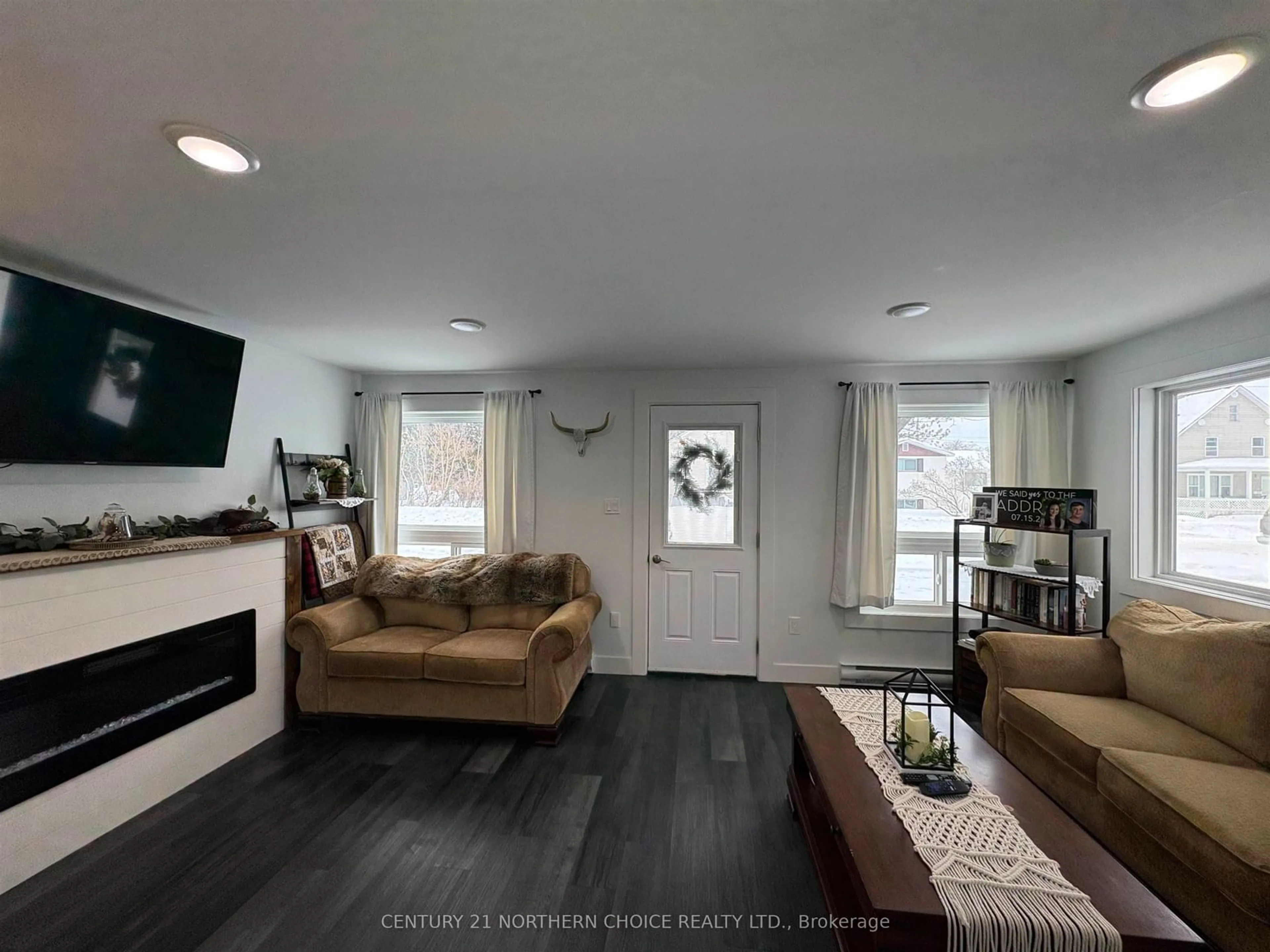 Living room with furniture, wood/laminate floor for 1026 Third St, Fort Frances Ontario P9A 1S4