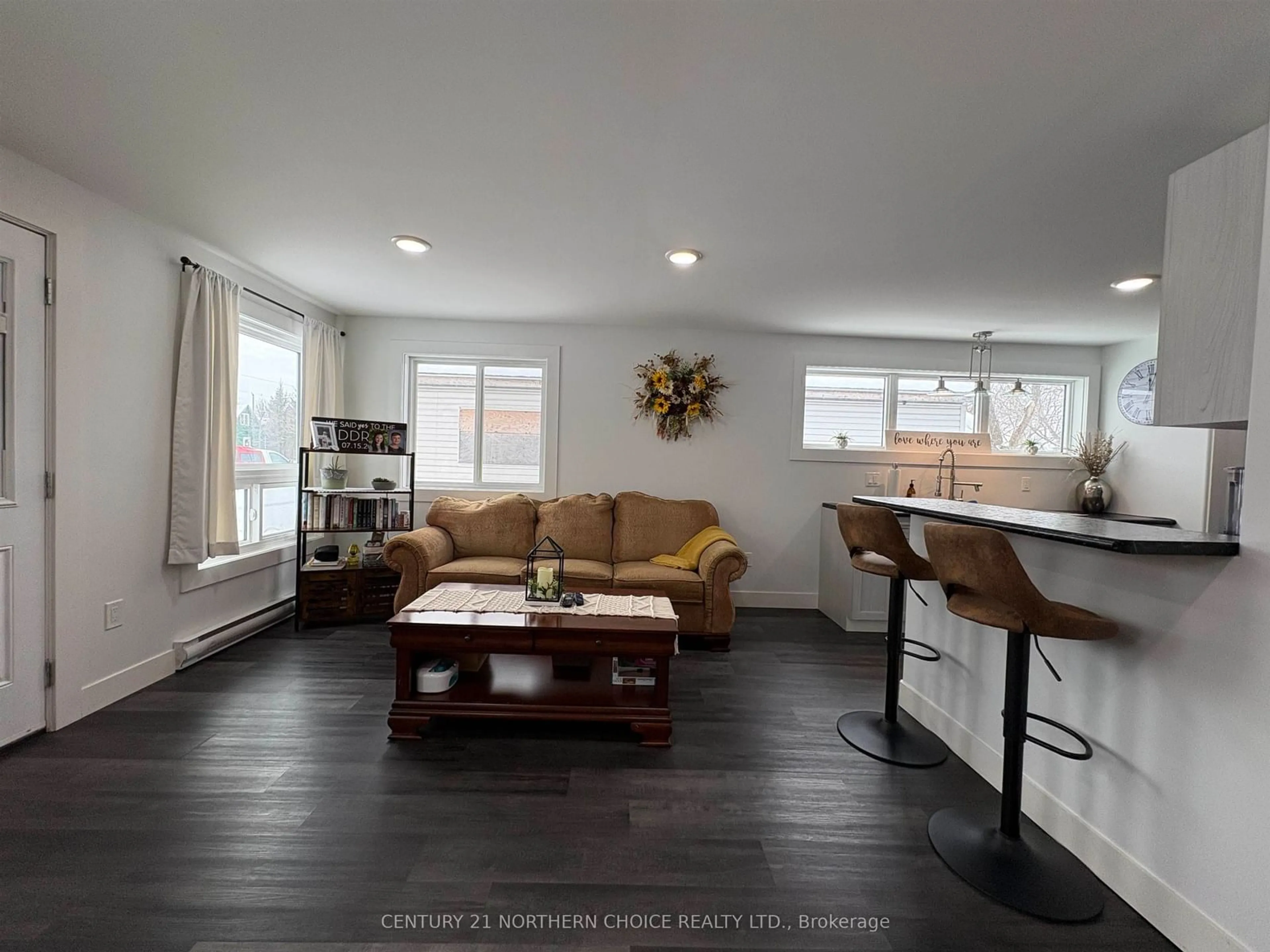 Living room with furniture, wood/laminate floor for 1026 Third St, Fort Frances Ontario P9A 1S4