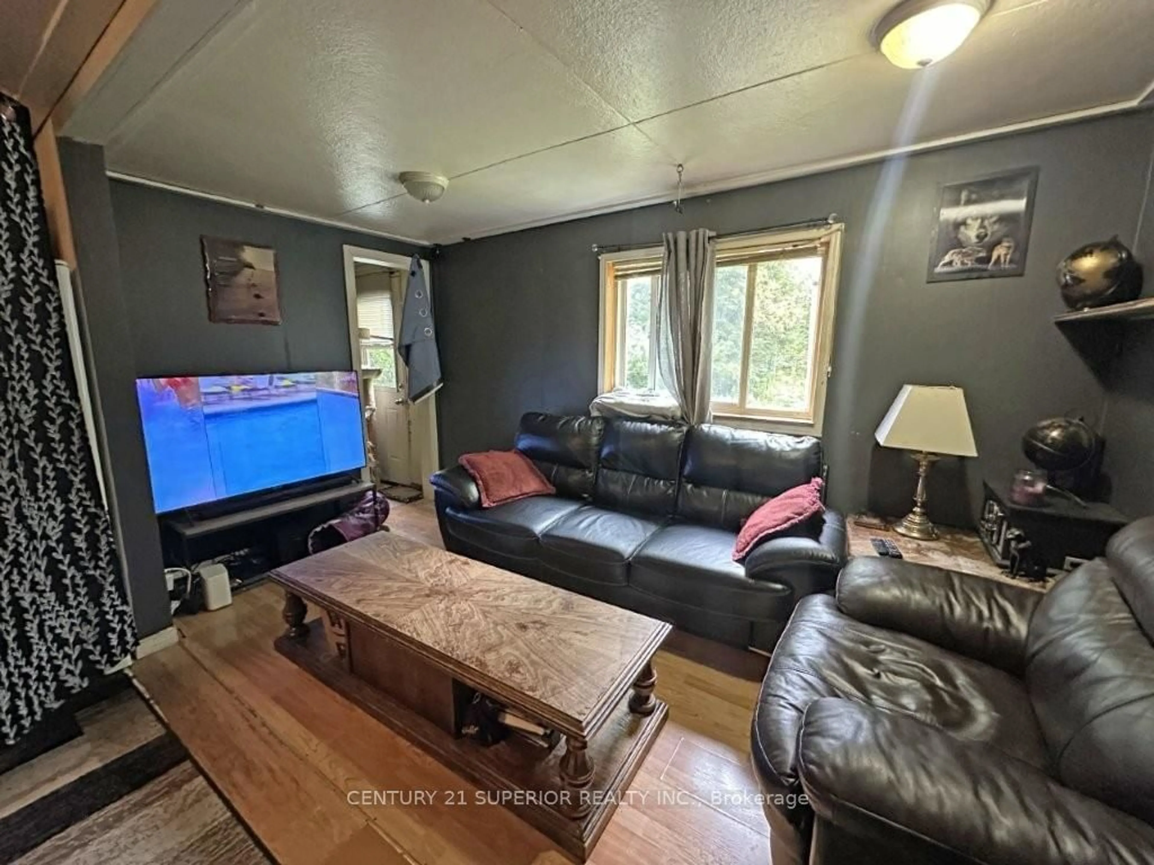 Living room with furniture, wood/laminate floor for 150 First Street, Nipigon Ontario P0T 2J0