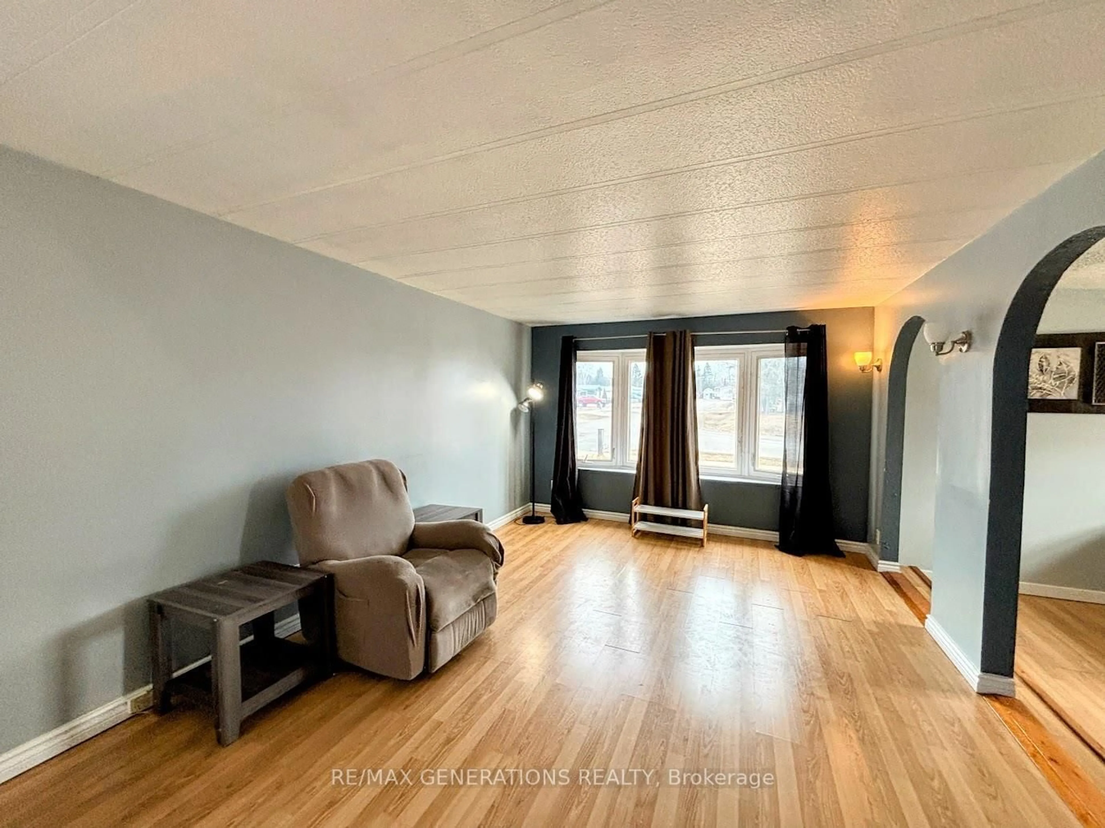 Living room with furniture, wood/laminate floor for 25 Coveney St, Marathon Ontario P0T 2E0