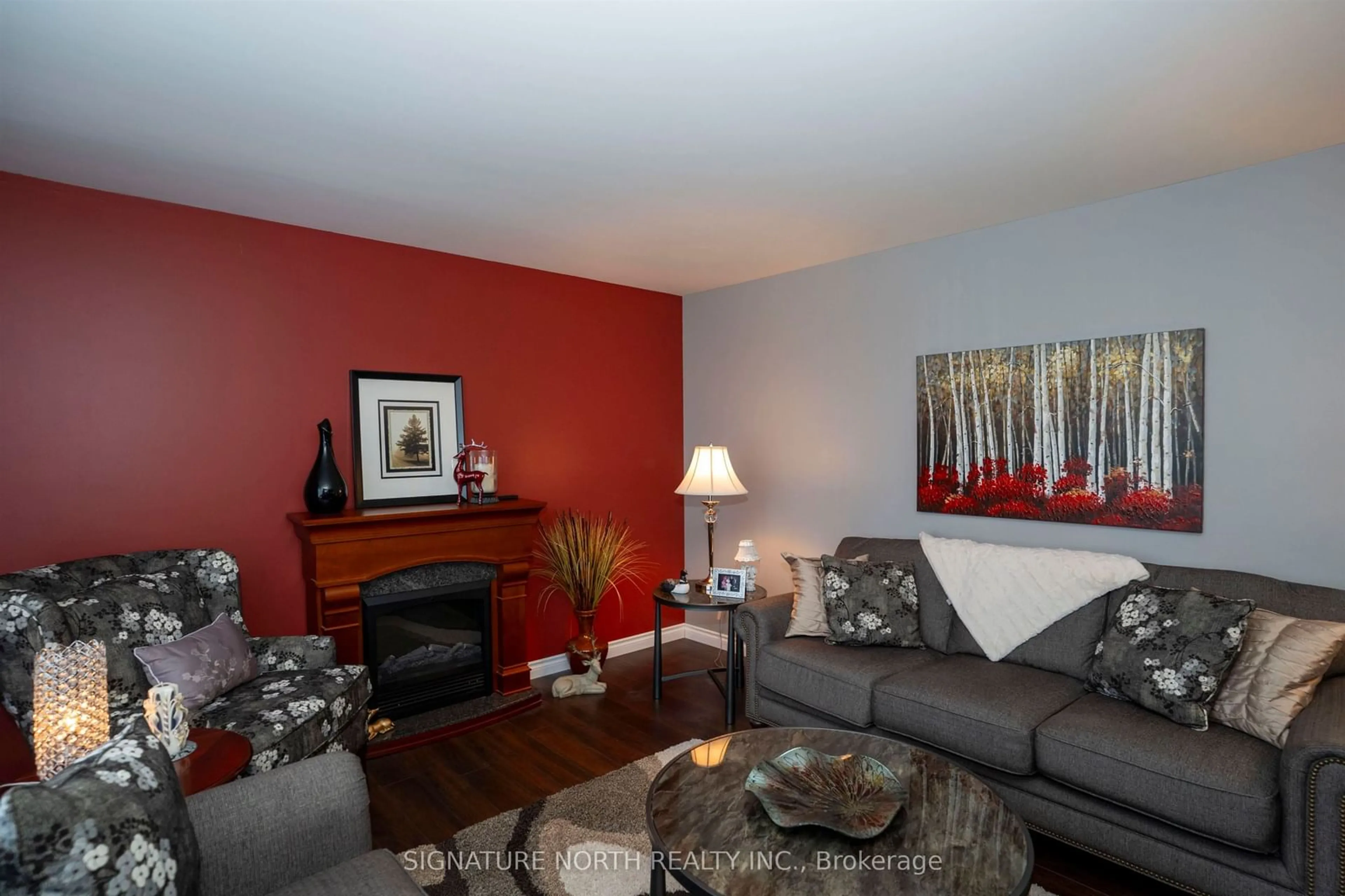 Living room with furniture, wood/laminate floor for 381 Hallam St, Thunder Bay Ontario P7A 1M2