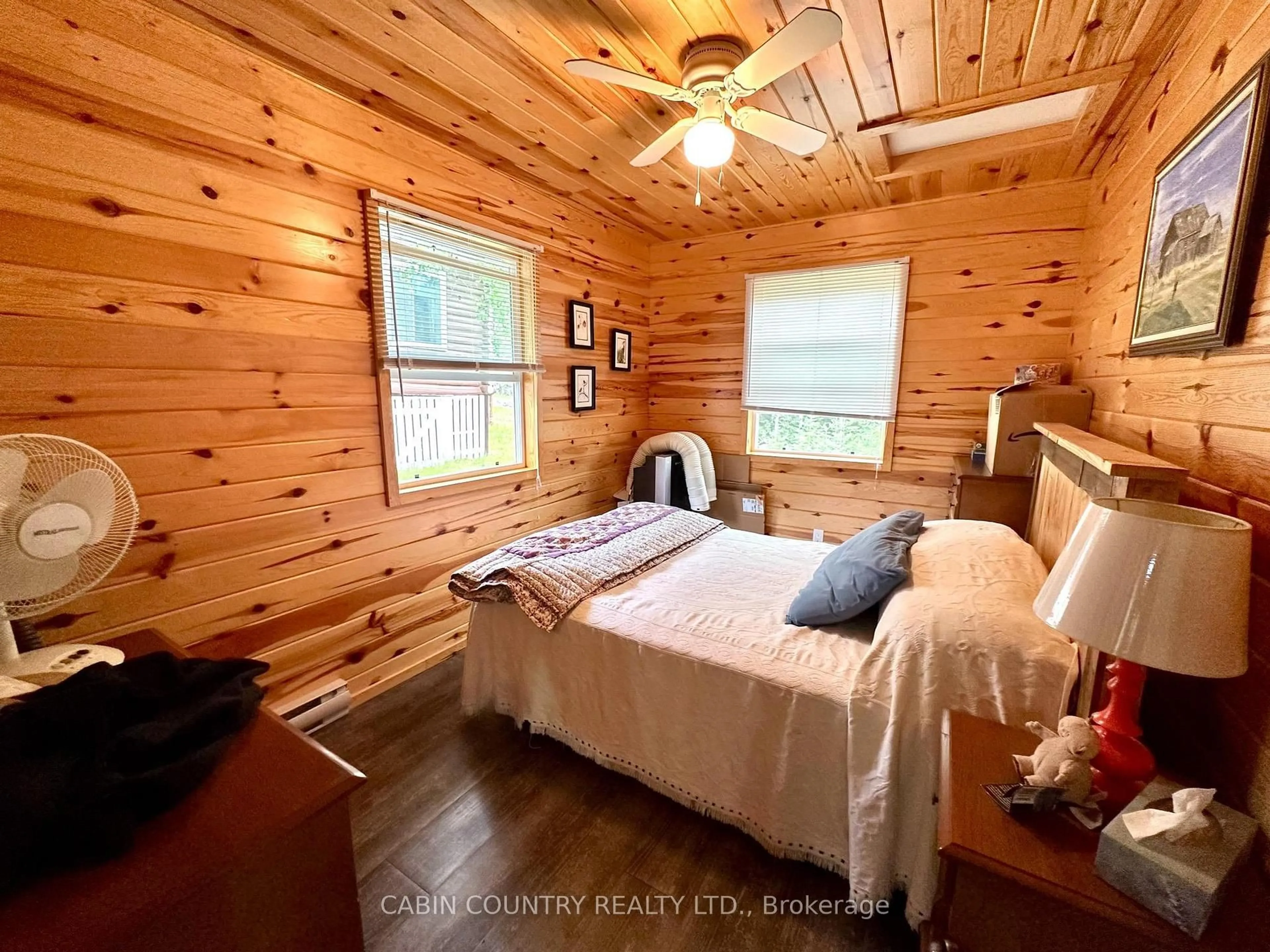 Bedroom with bed, wood/laminate floor for 1842-6B Sherwood Lake Road, Kenora Remote Area Ontario P0X 1H0