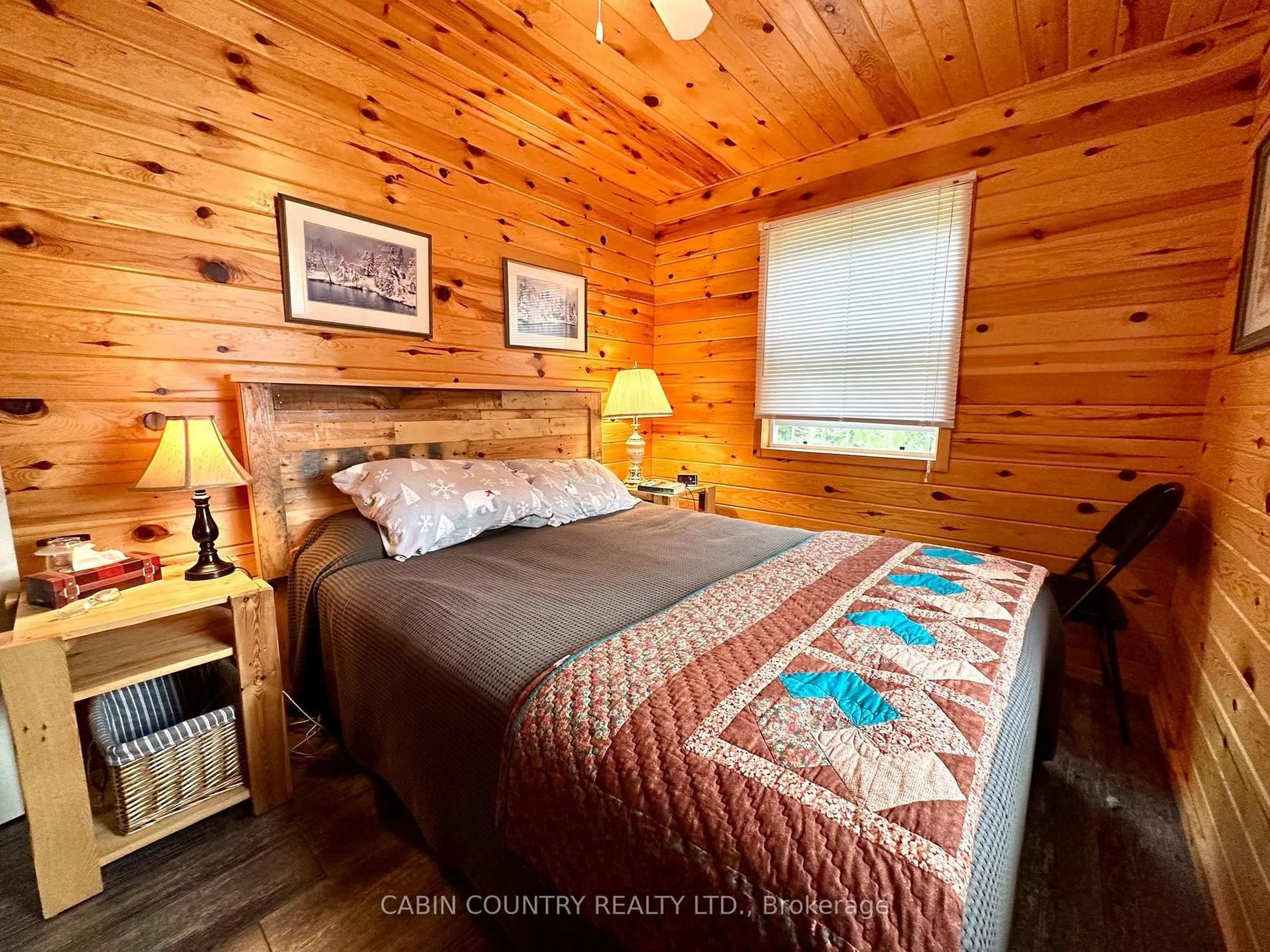 Bedroom with bed, wood/laminate floor for 1842-6B Sherwood Lake Road, Kenora Remote Area Ontario P0X 1H0