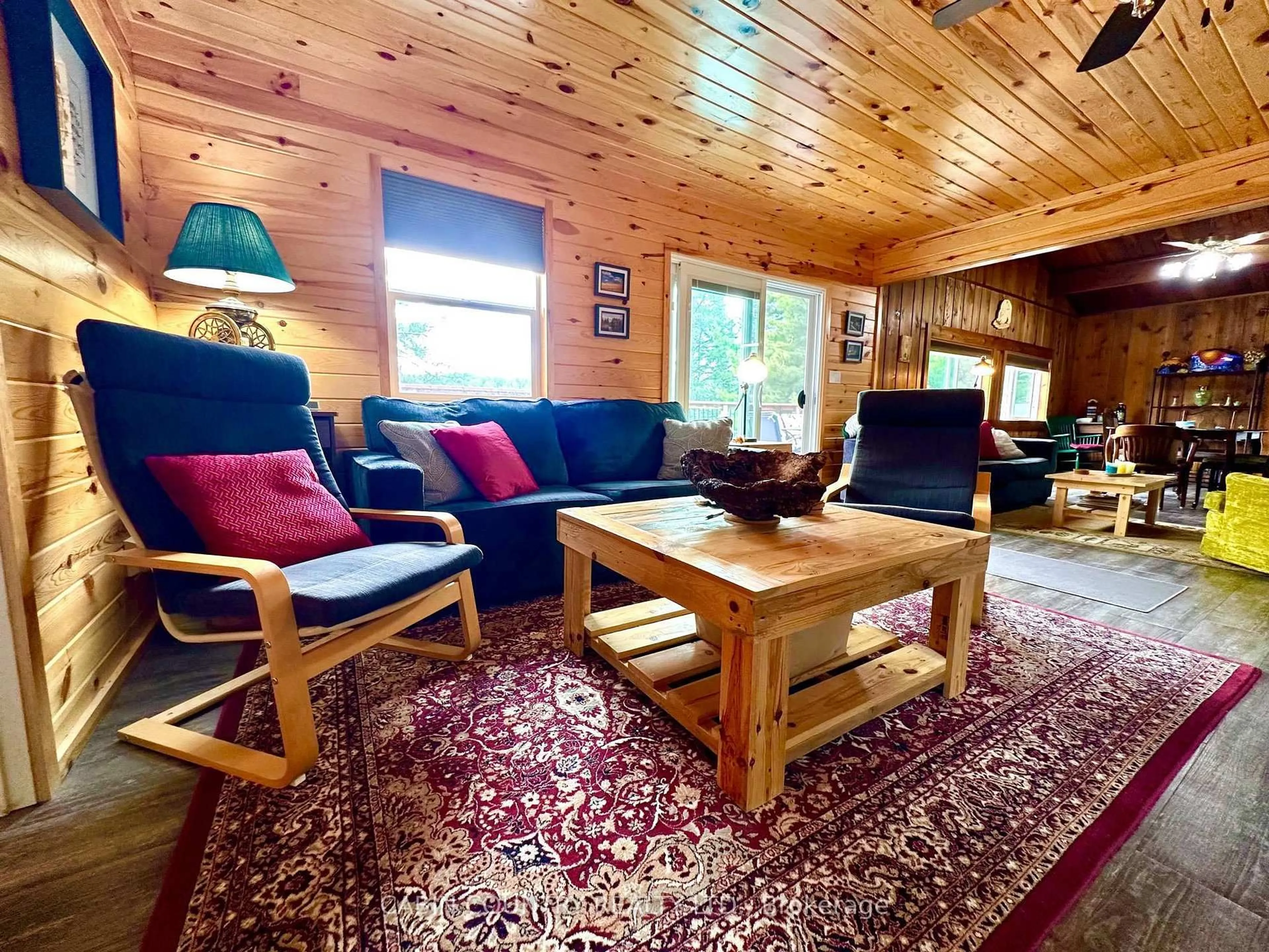 Living room with furniture, wood/laminate floor for 1842-6B Sherwood Lake Road, Kenora Remote Area Ontario P0X 1H0