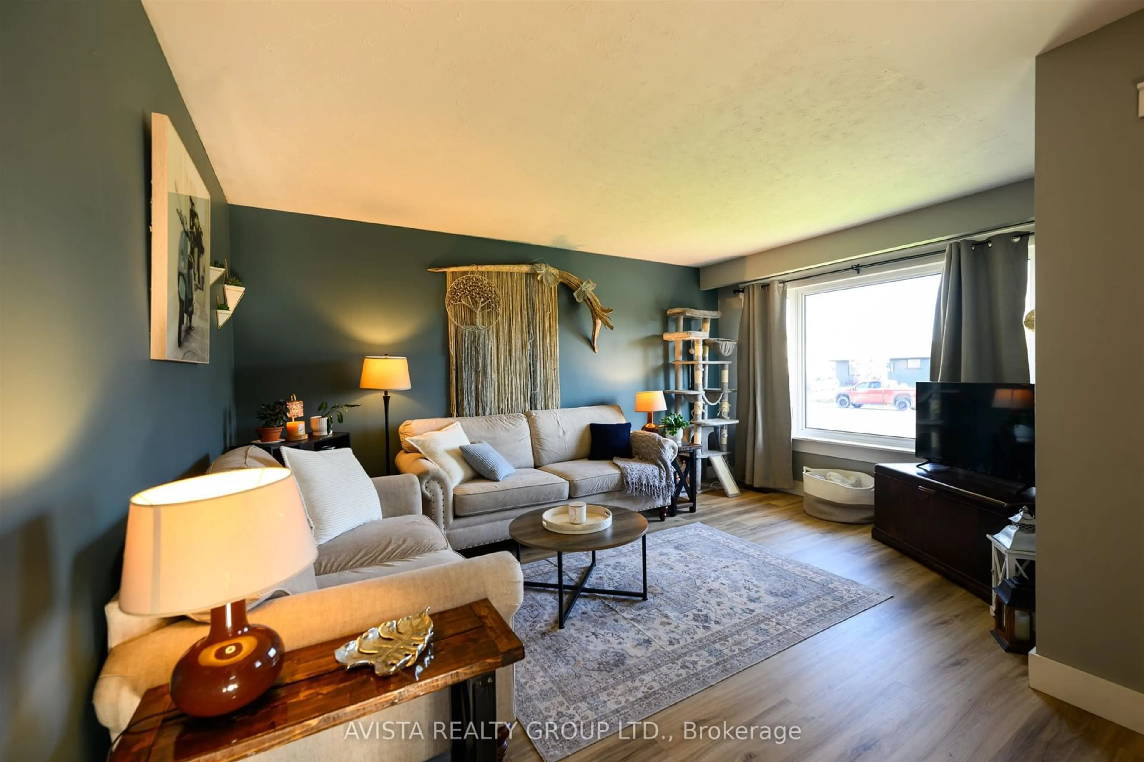 Living room with furniture, wood/laminate floor for 112 Walsh St West, Thunder Bay Ontario P7E 4W4