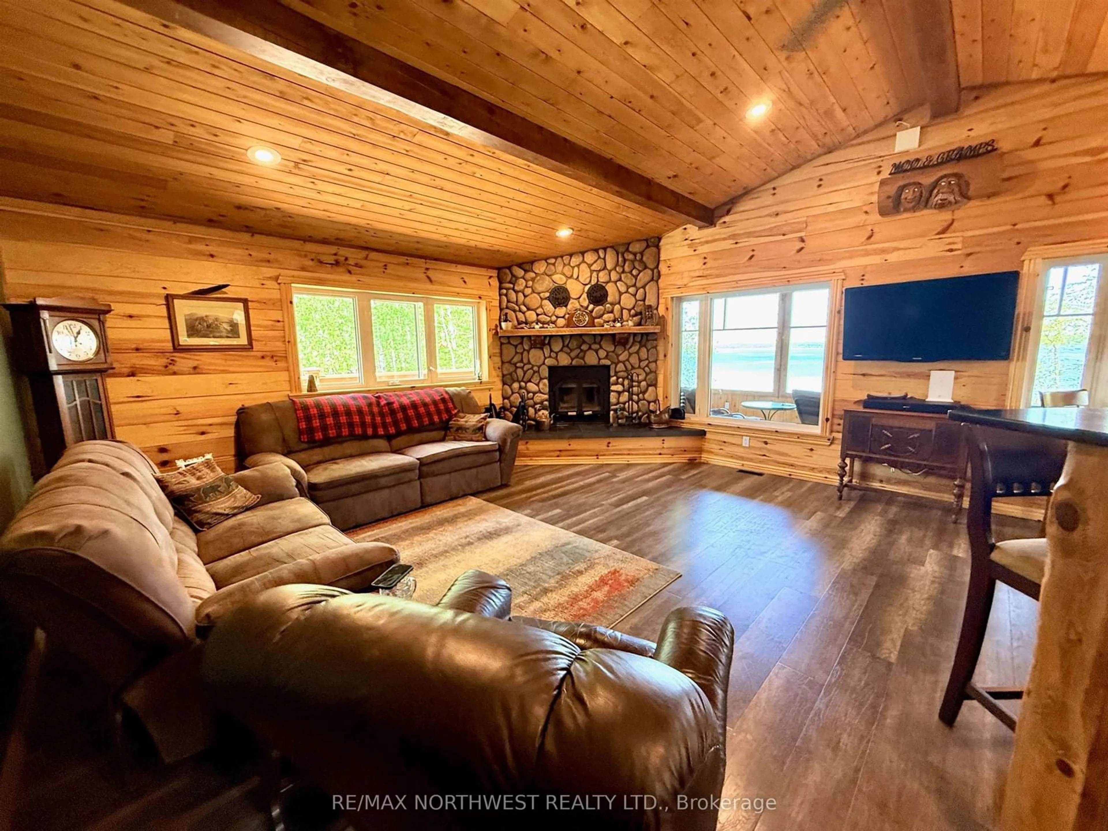 Living room with furniture, wood/laminate floor for 46 Aztec Drive, Sioux Narrows-Nestor Falls Ontario P0X 1N0
