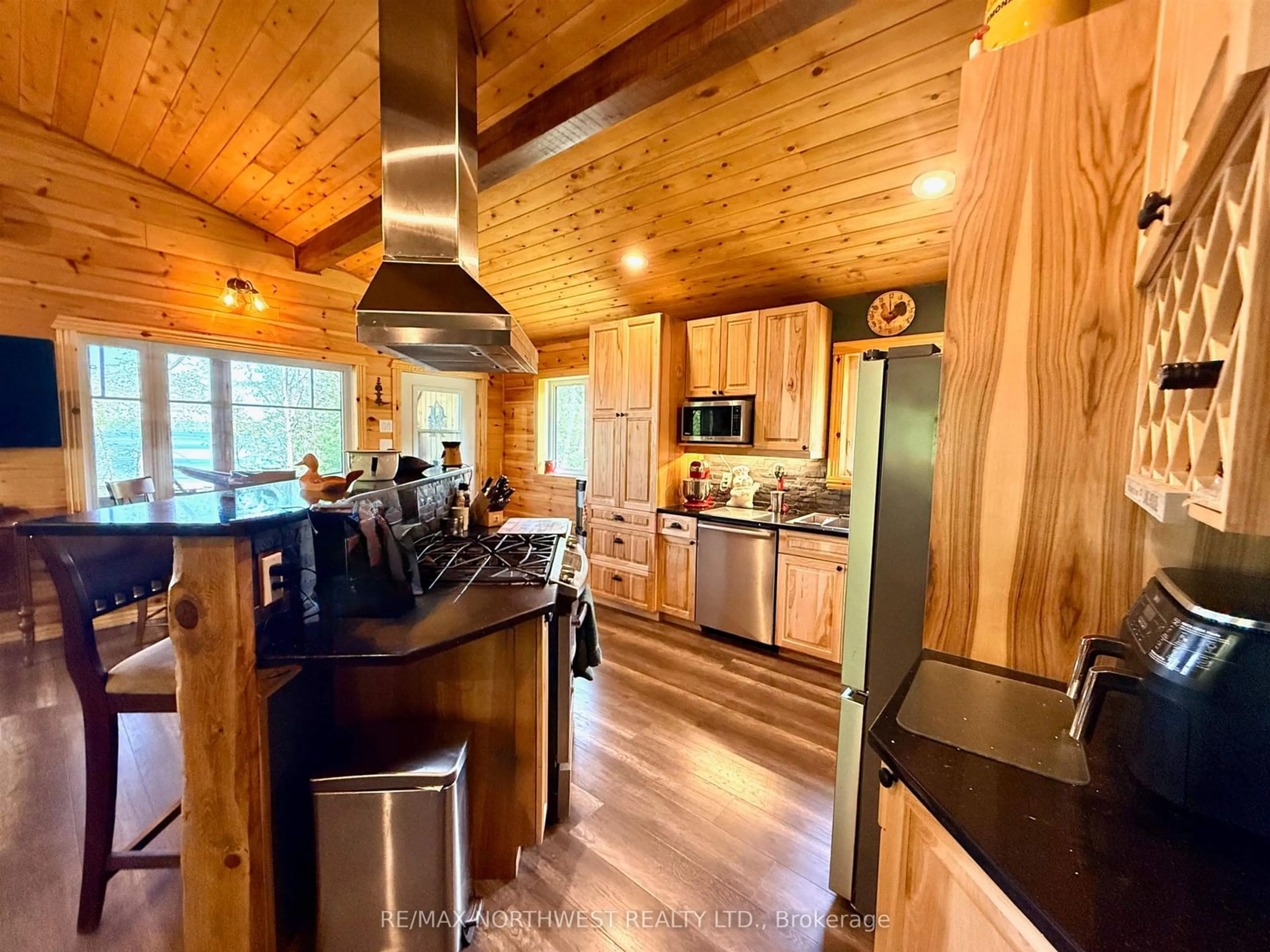 Open concept kitchen, wood/laminate floor for 46 Aztec Drive, Sioux Narrows-Nestor Falls Ontario P0X 1N0
