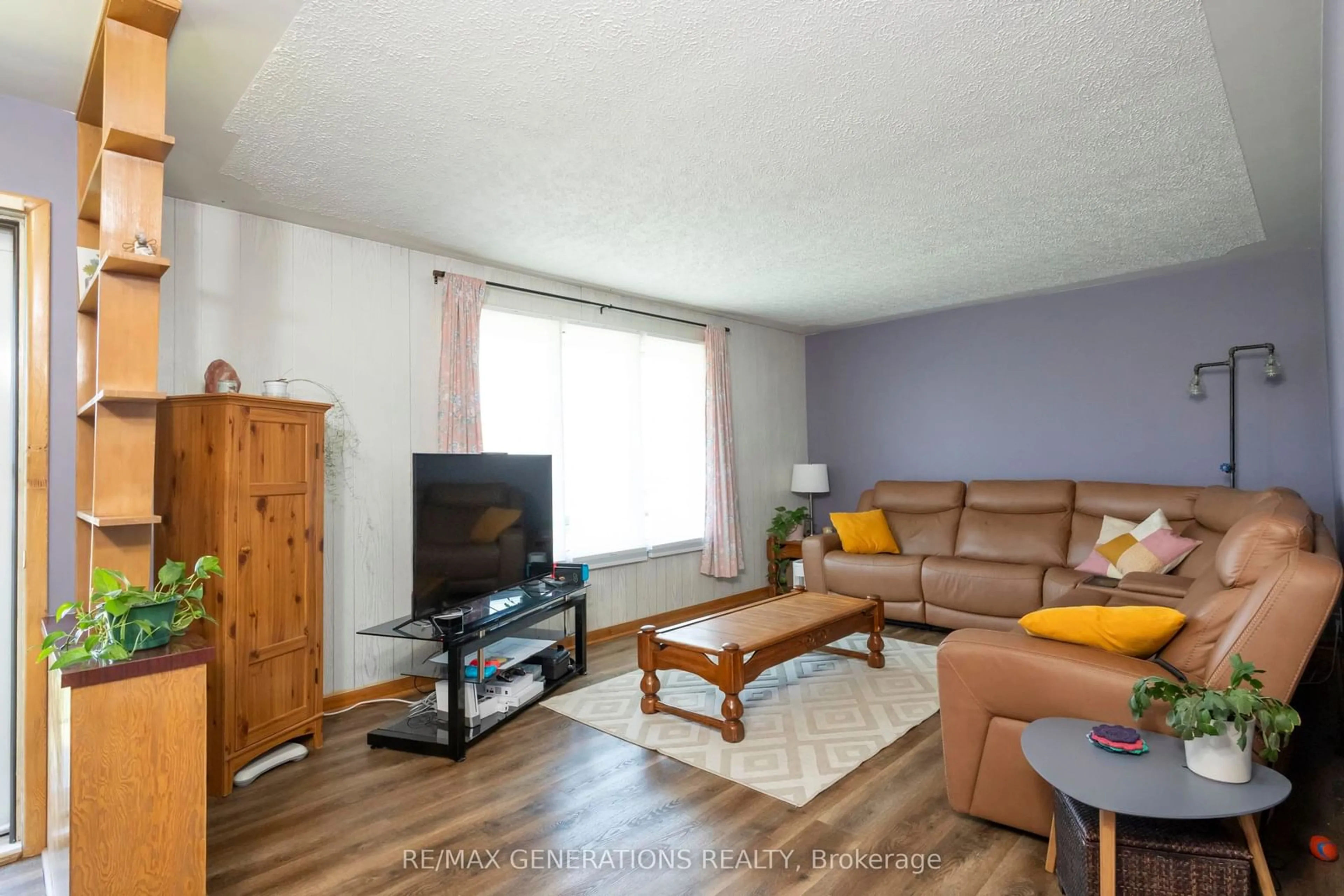 Living room with furniture, wood/laminate floor for 112 IBBETSON St, Thunder Bay Ontario P7A 7J9