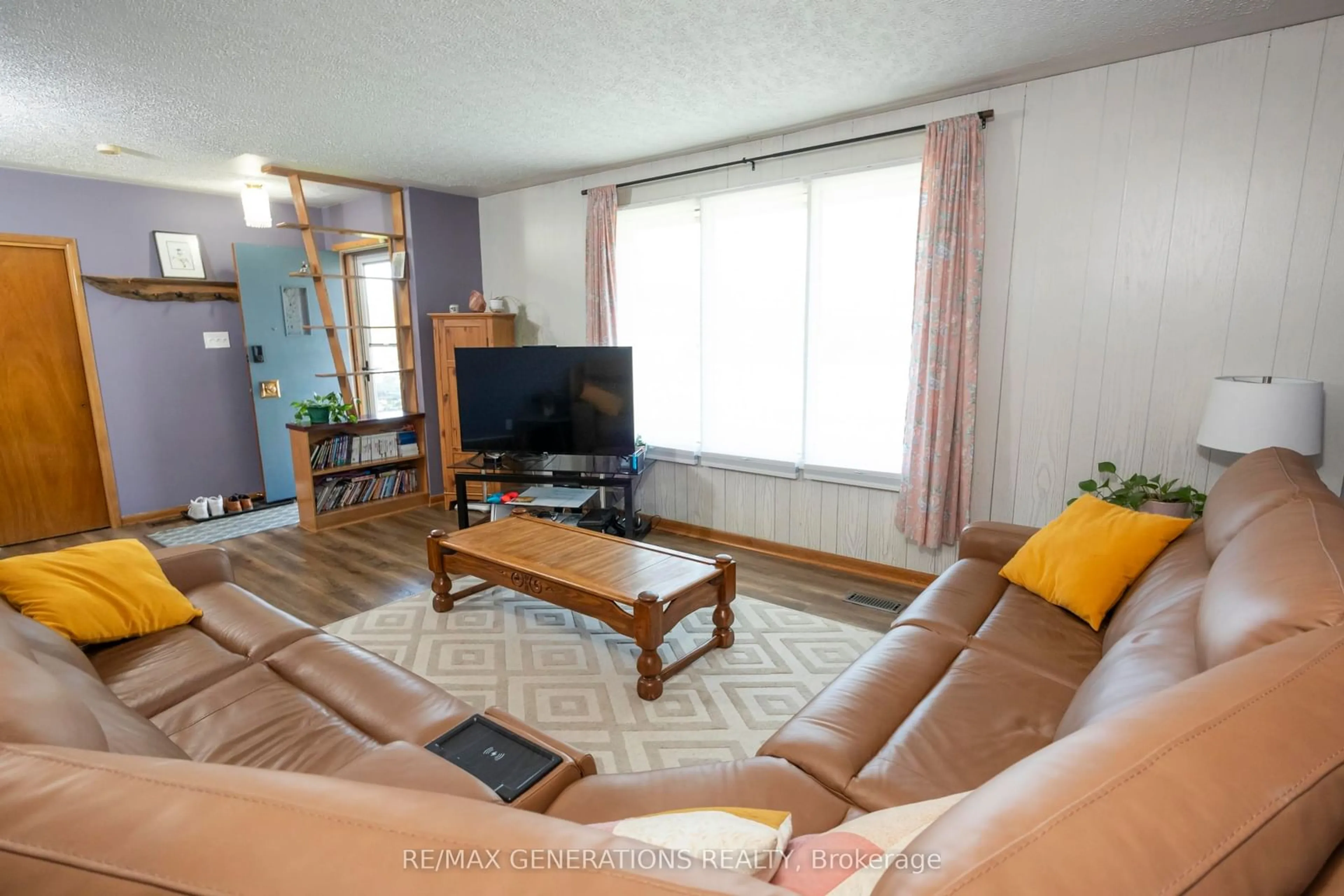 Living room with furniture, wood/laminate floor for 112 IBBETSON St, Thunder Bay Ontario P7A 7J9