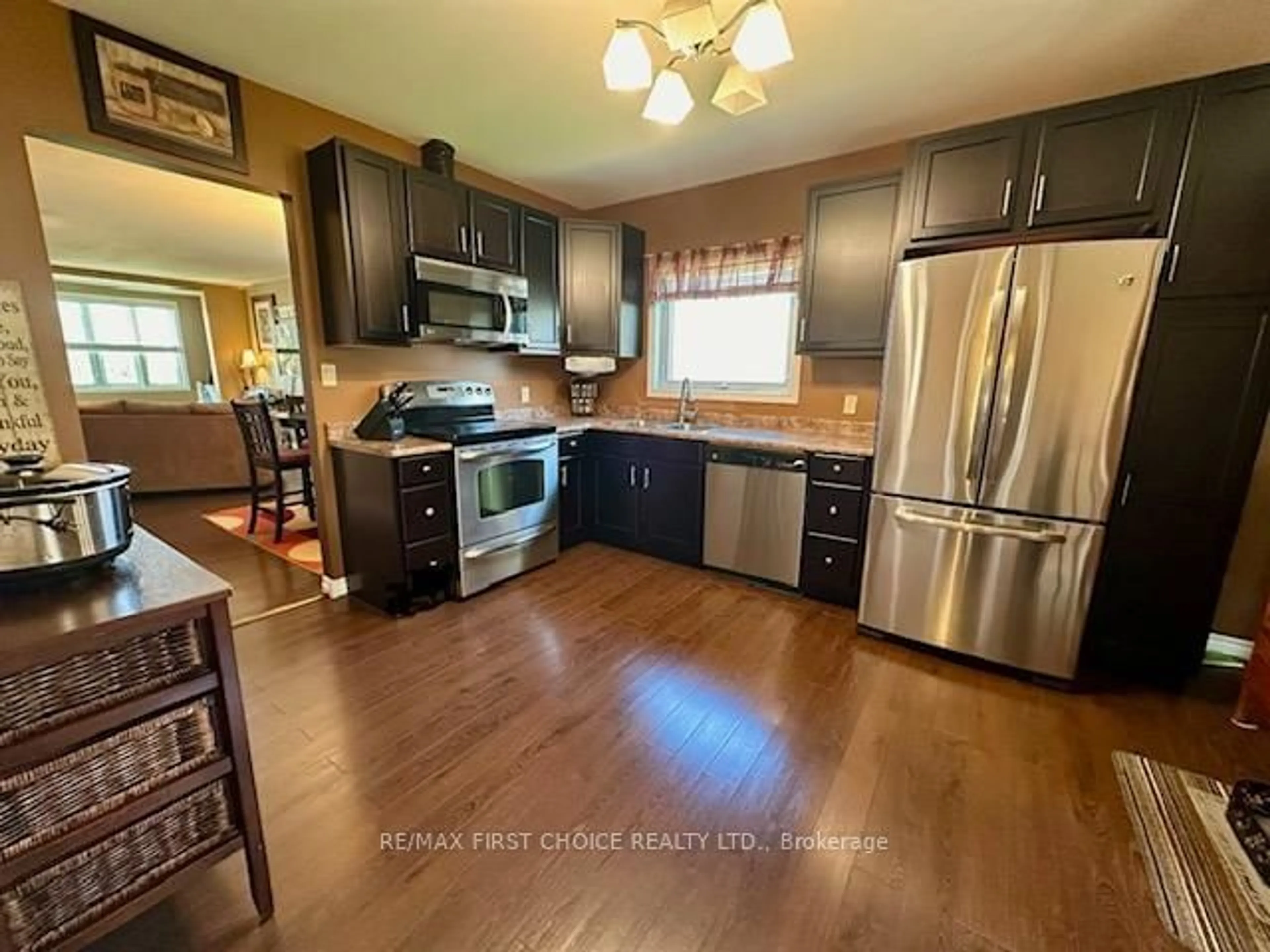 Open concept kitchen, wood/laminate floor for 45 Kenogami Ave, Thunder Bay Ontario P7A 6C8