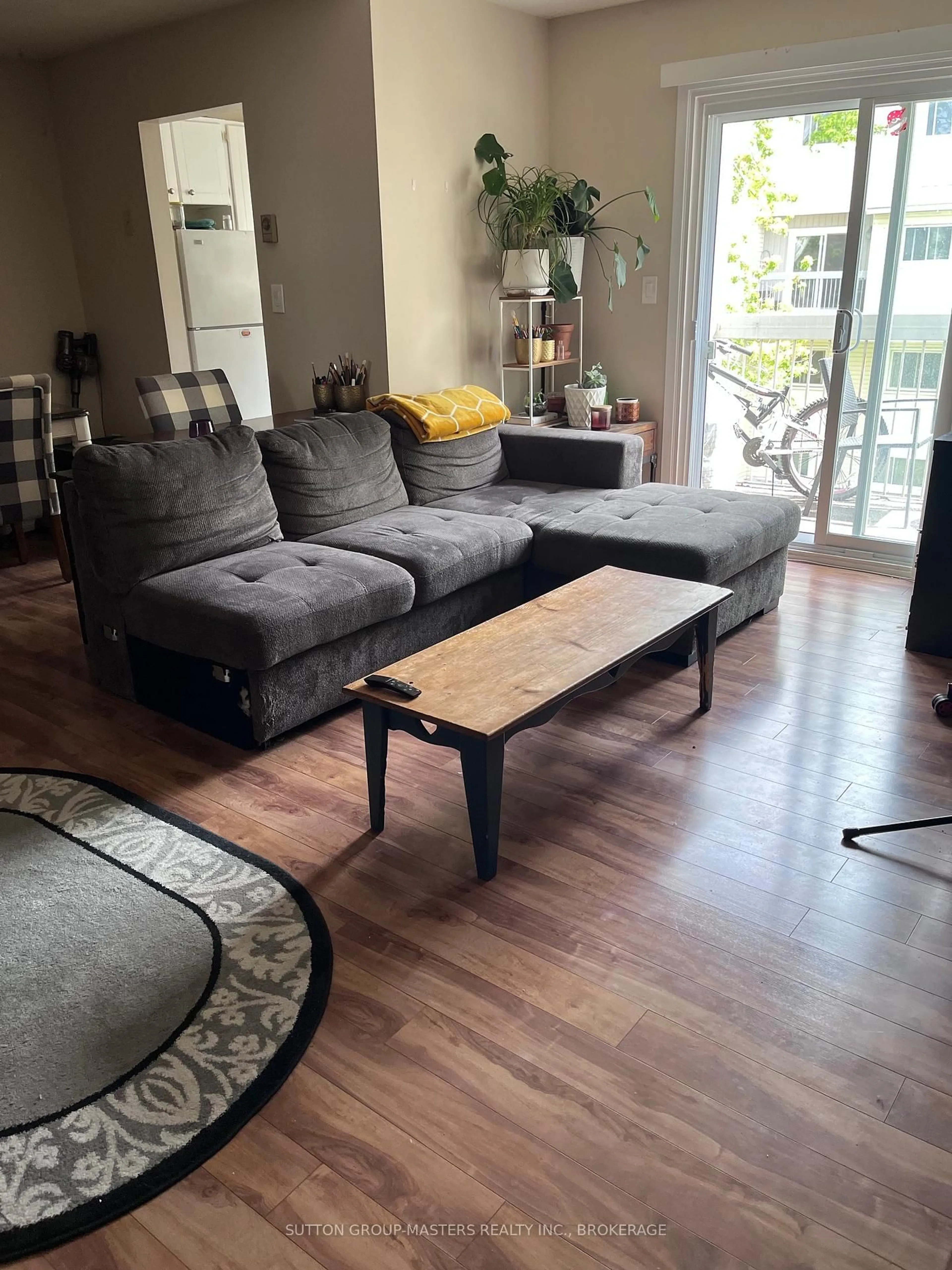 Living room with furniture, wood/laminate floor for 1000 Pembridge Cres #307, Kingston Ontario K7P 1A3