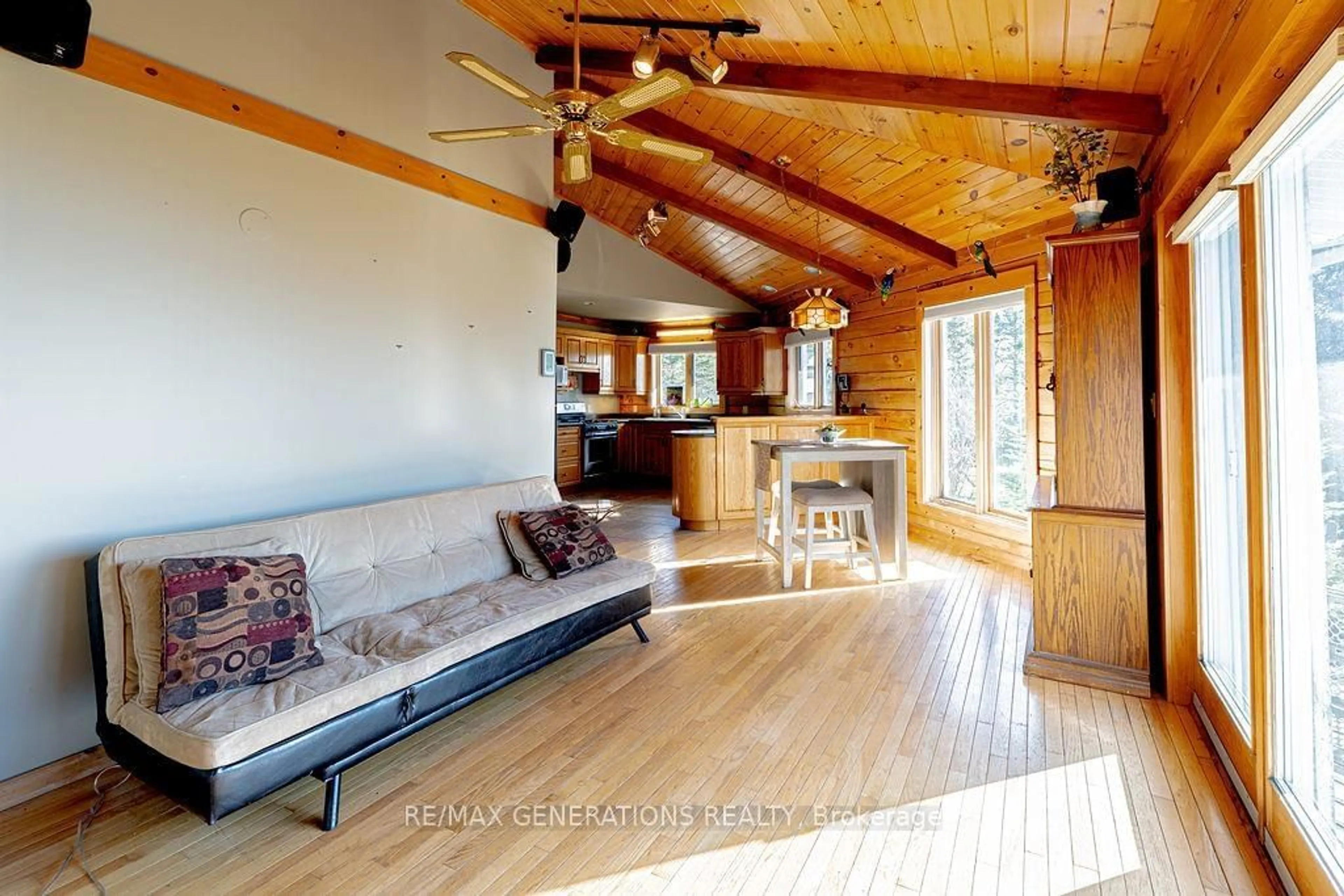 Living room with furniture, wood/laminate floor for 106 ISLAND Ave, Neebing Ontario P7L 0C1
