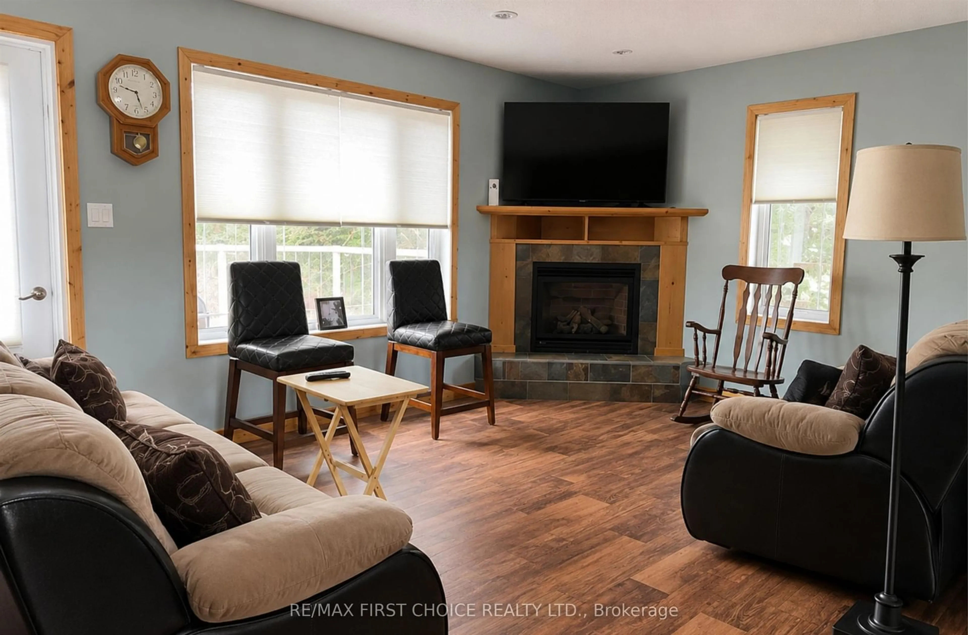Living room with furniture, wood/laminate floor for 6086 Hwy 11/71, Emo Ontario P0W 1E0