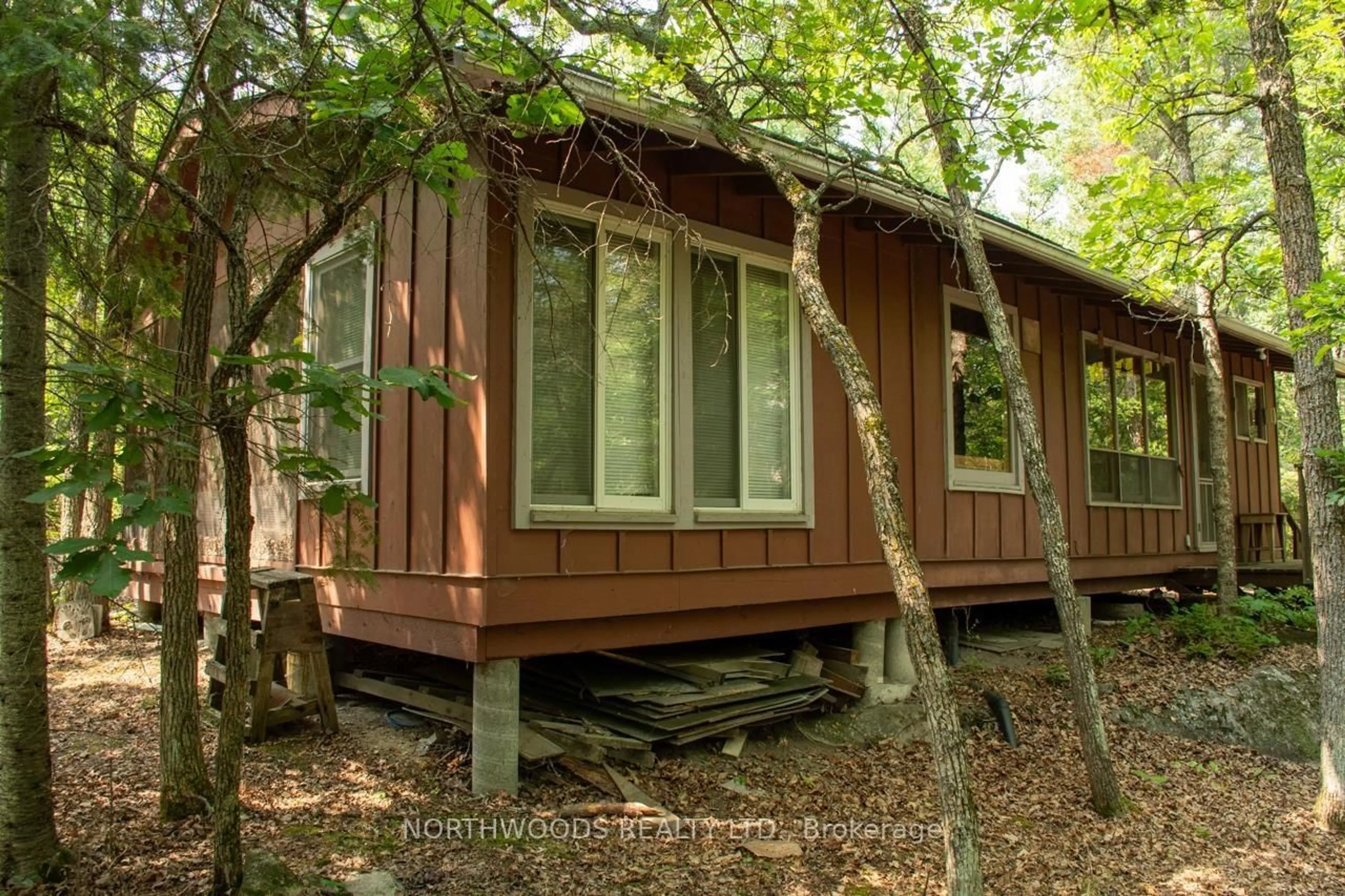 Home with vinyl exterior material, forest/trees view for 40 Ottilie Road, Lake of the Woods Ontario P0W 1J0