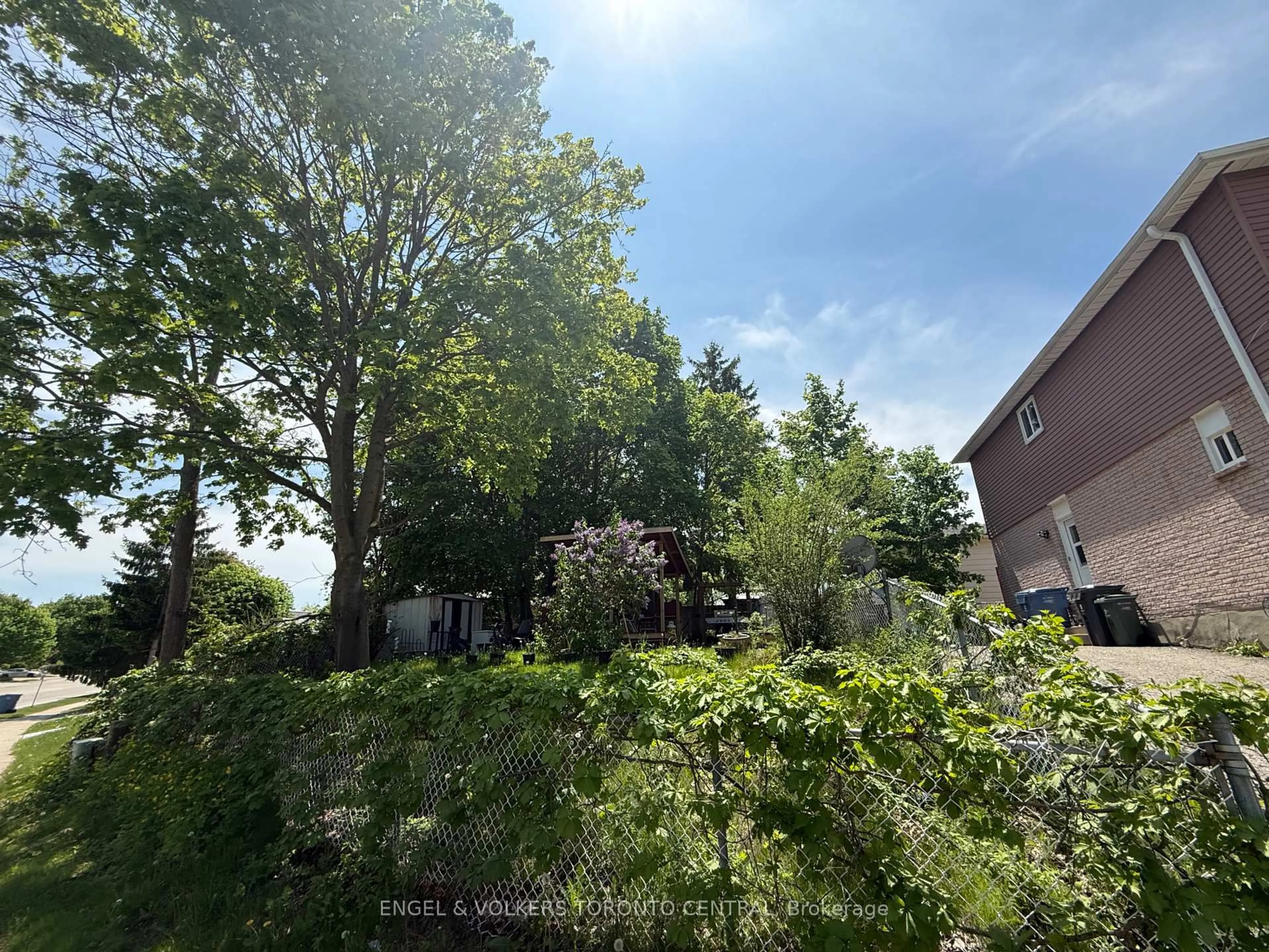 A pic from outside/outdoor area/front of a property/back of a property/a pic from drone, forest/trees view for 689 College Ave, Guelph Ontario N1G 2Y2