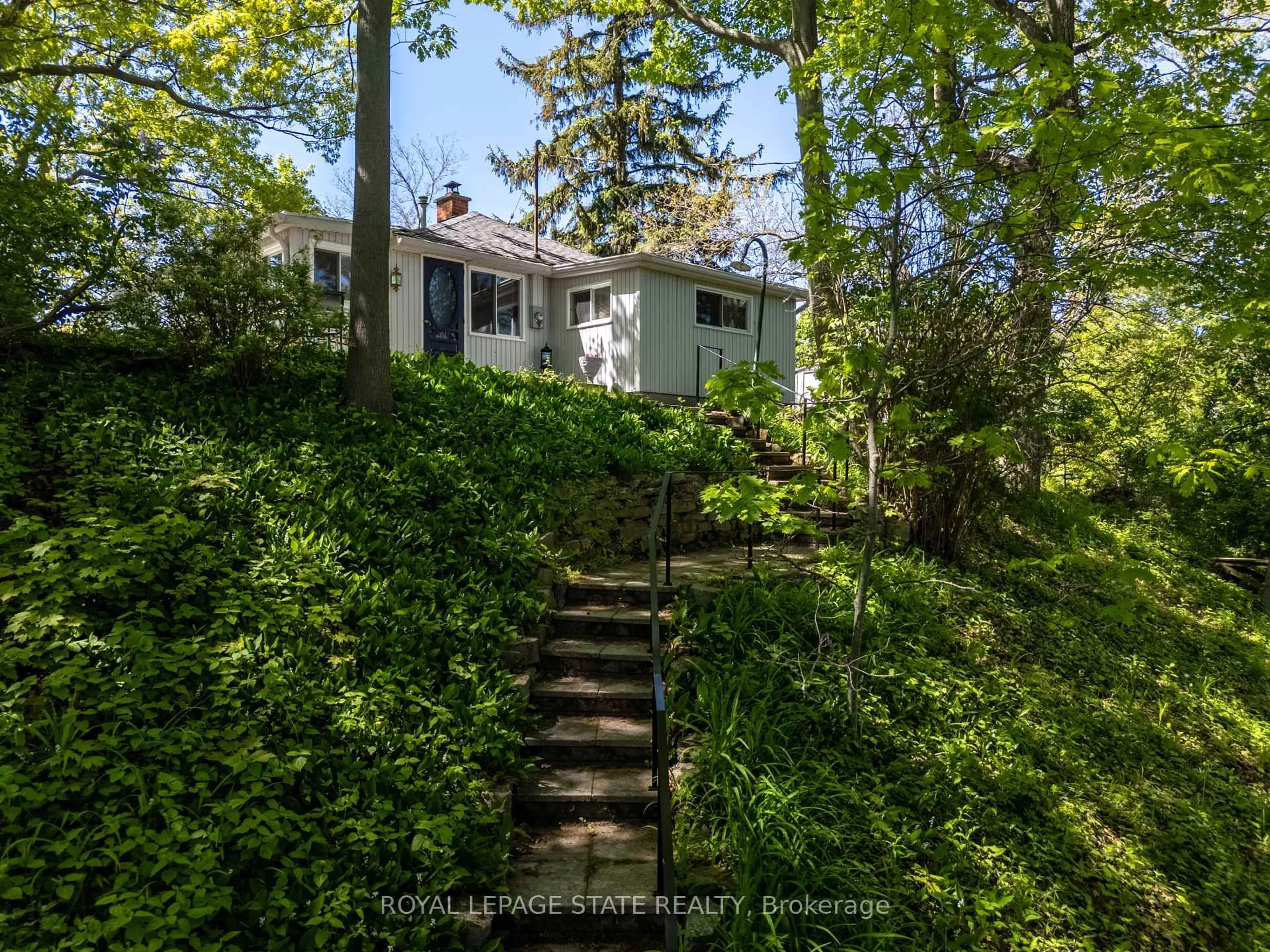 A pic from outside/outdoor area/front of a property/back of a property/a pic from drone, forest/trees view for 689 Sandy Bay Rd, Haldimand Ontario N1A 2W6