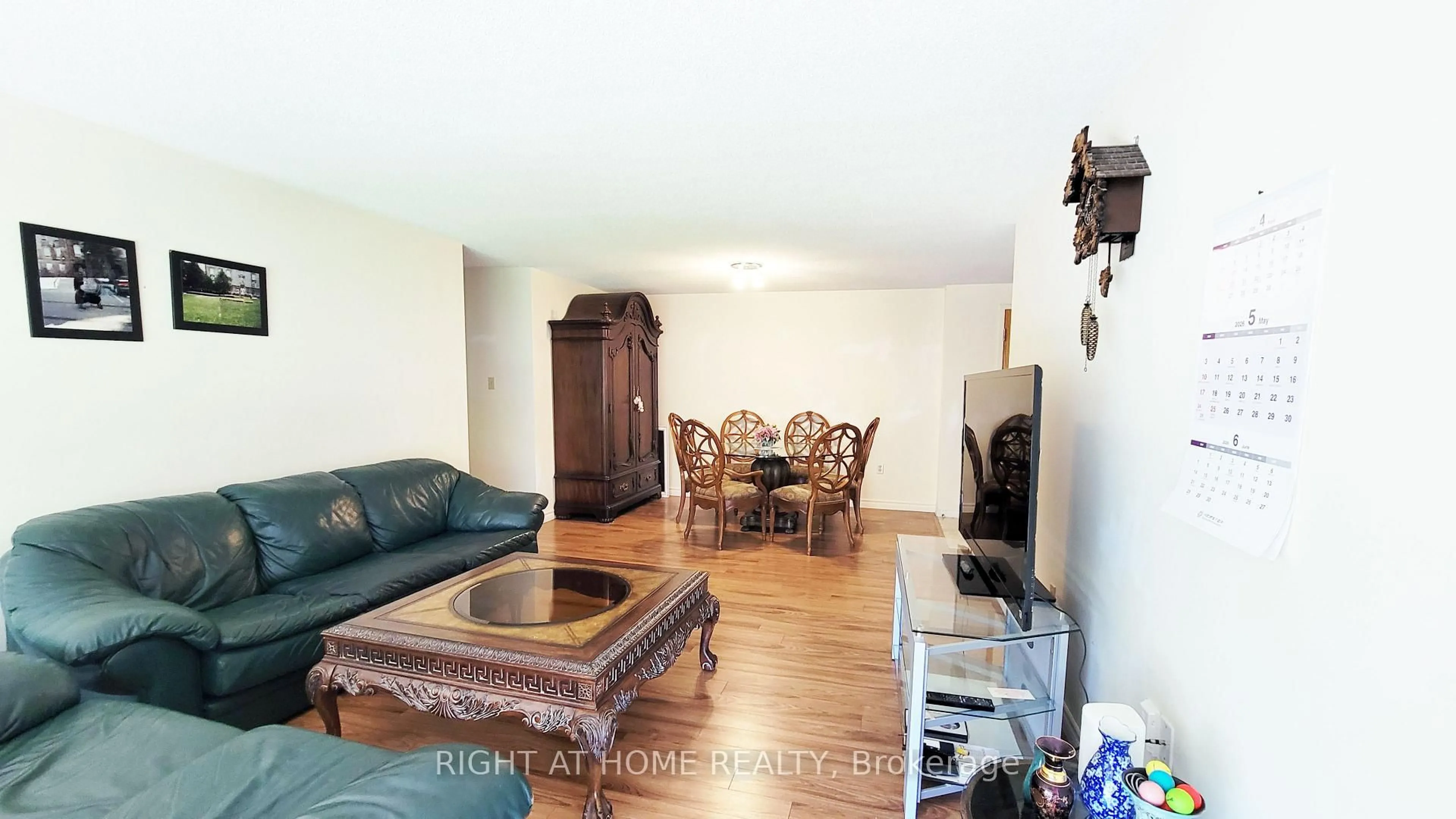 Living room with furniture, wood/laminate floor for 55 Blue Springs Dr #302, Waterloo Ontario N2J 4T3