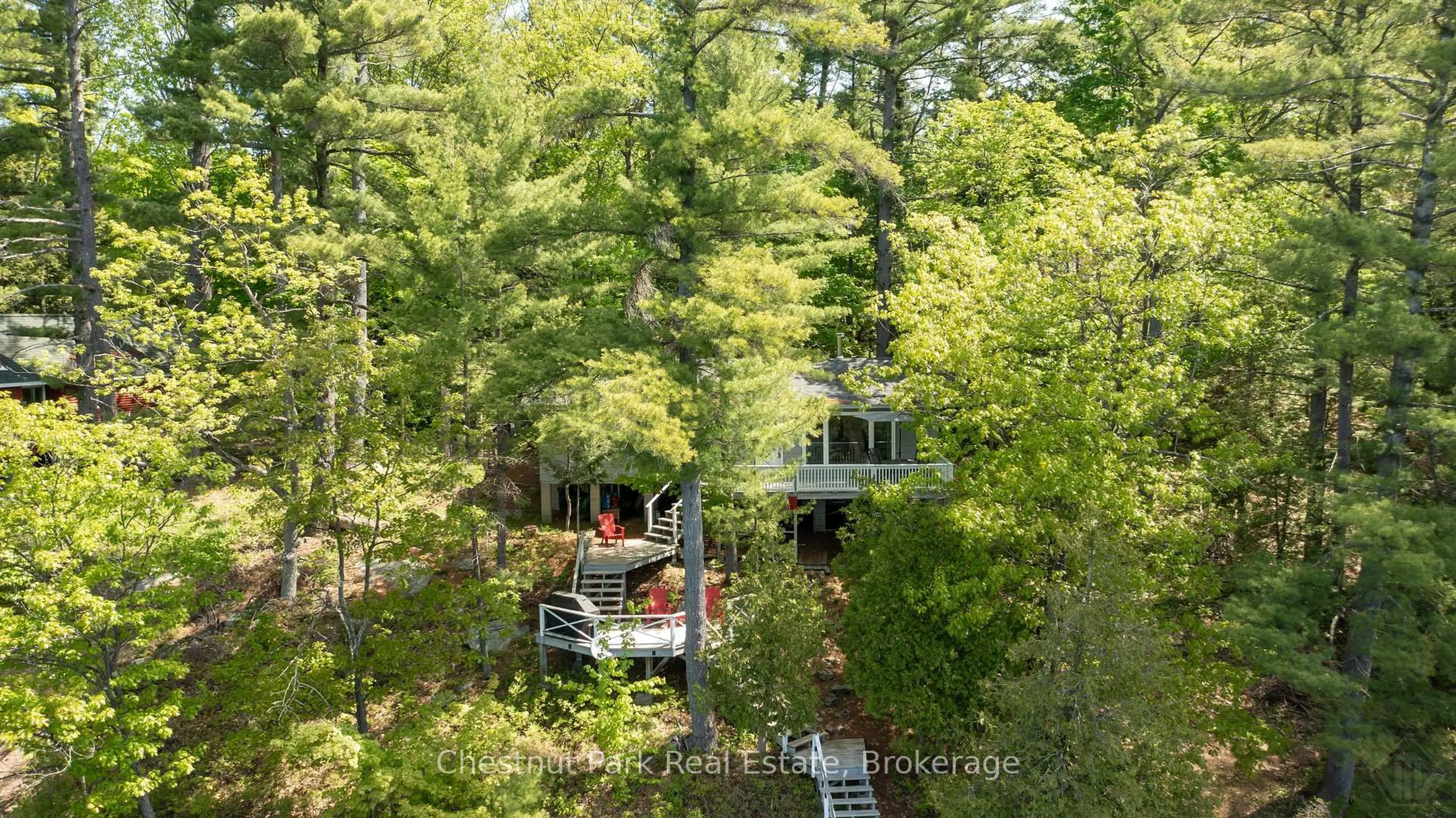 A pic from outside/outdoor area/front of a property/back of a property/a pic from drone, forest/trees view for 85 Taylor Island, Gravenhurst Ontario P1P 1R2