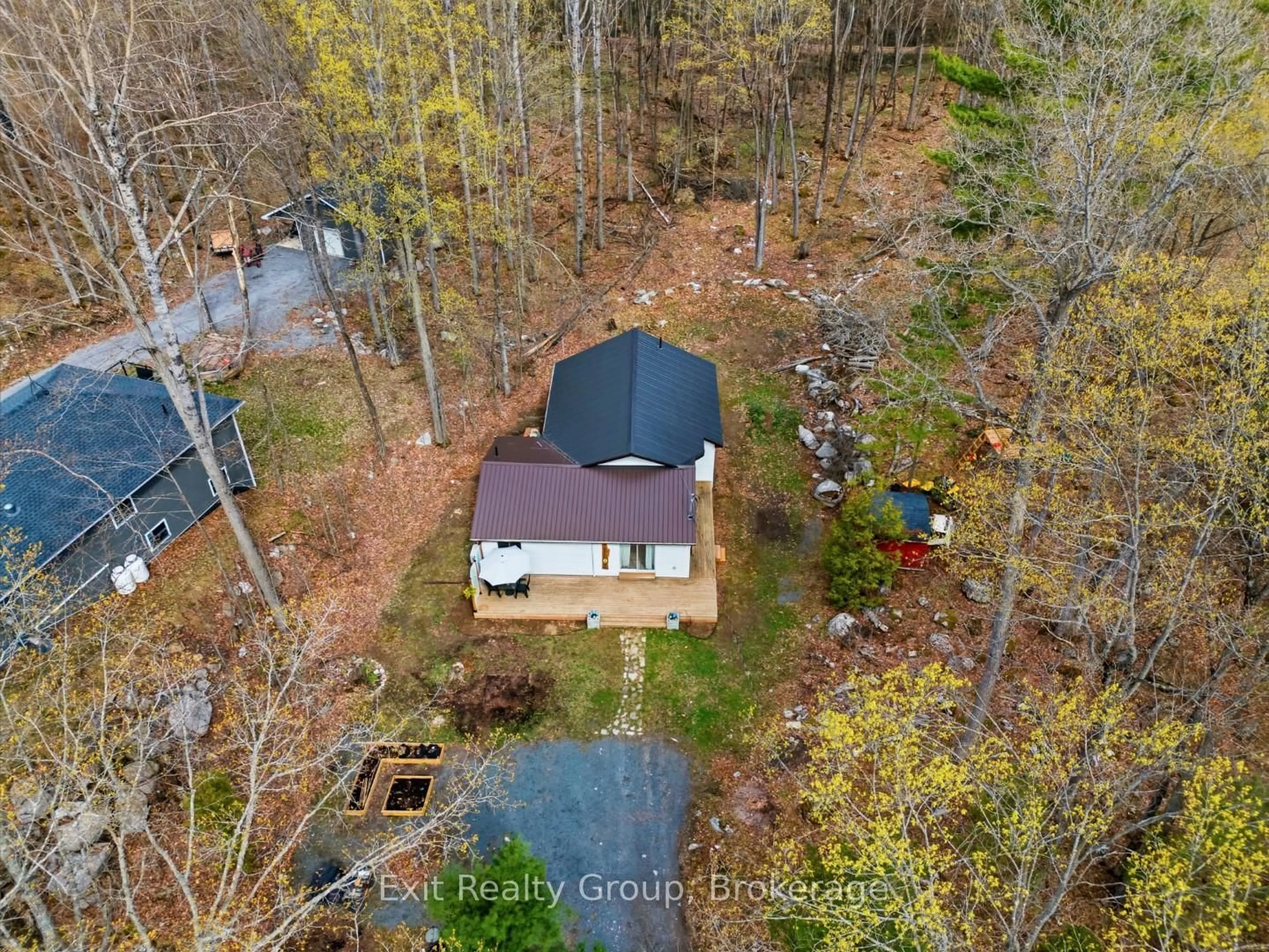 A pic from outside/outdoor area/front of a property/back of a property/a pic from drone, forest/trees view for 54 Paradise Rd, Limoges Ontario K0K 2M0