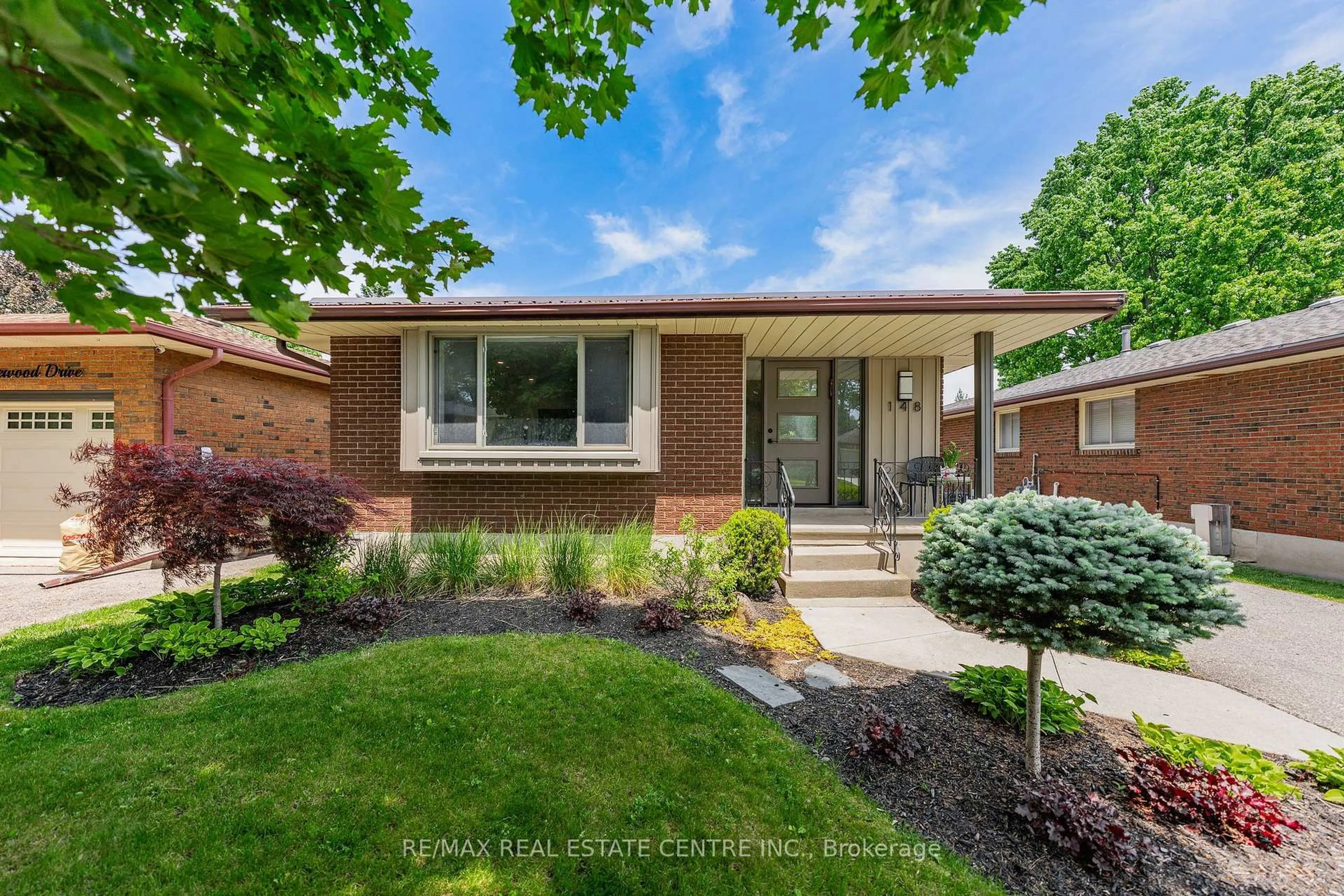 Home with brick exterior material, street for 148 Wedgewood Dr, Cambridge Ontario N1S 3X9
