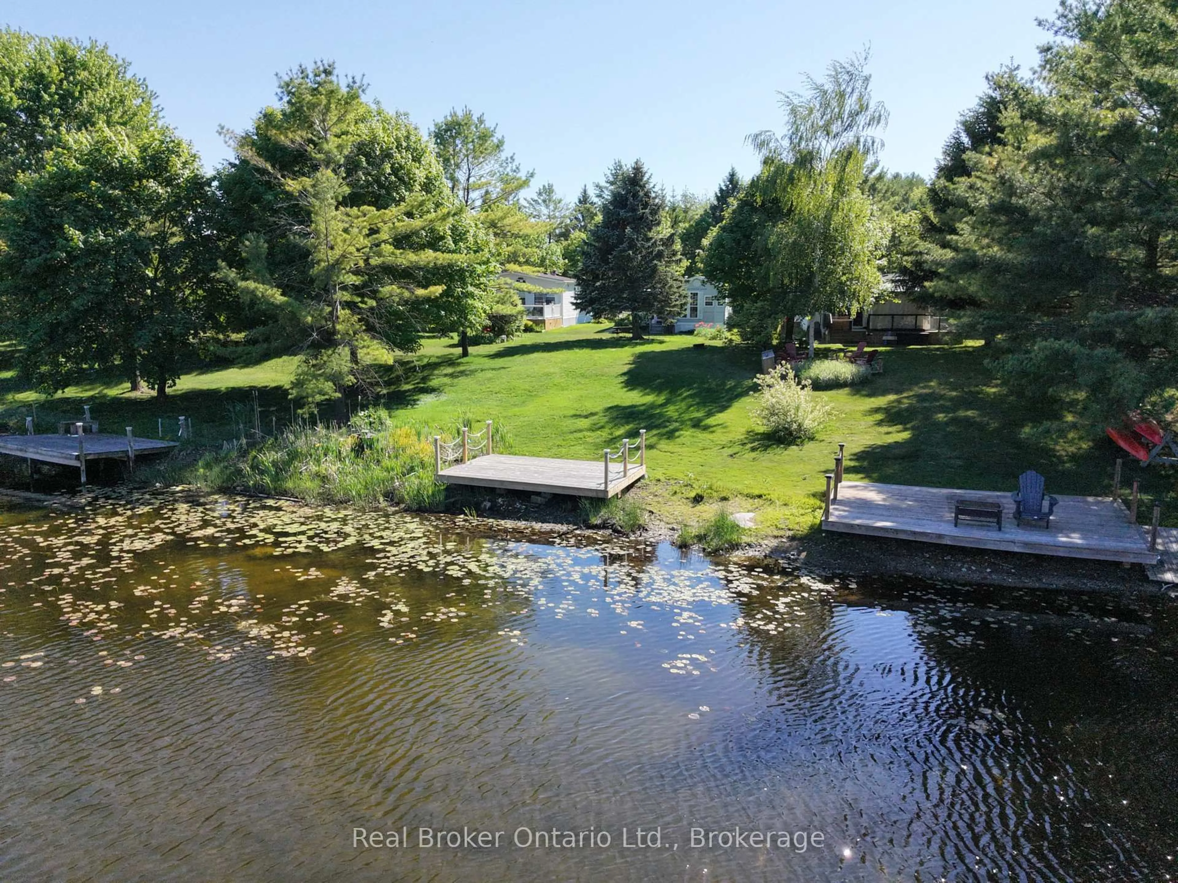 A pic from outside/outdoor area/front of a property/back of a property/a pic from drone, water/lake/river/ocean view for 13 Southline Ave #M39, Huron-Kinloss Ontario N2Z 2X5