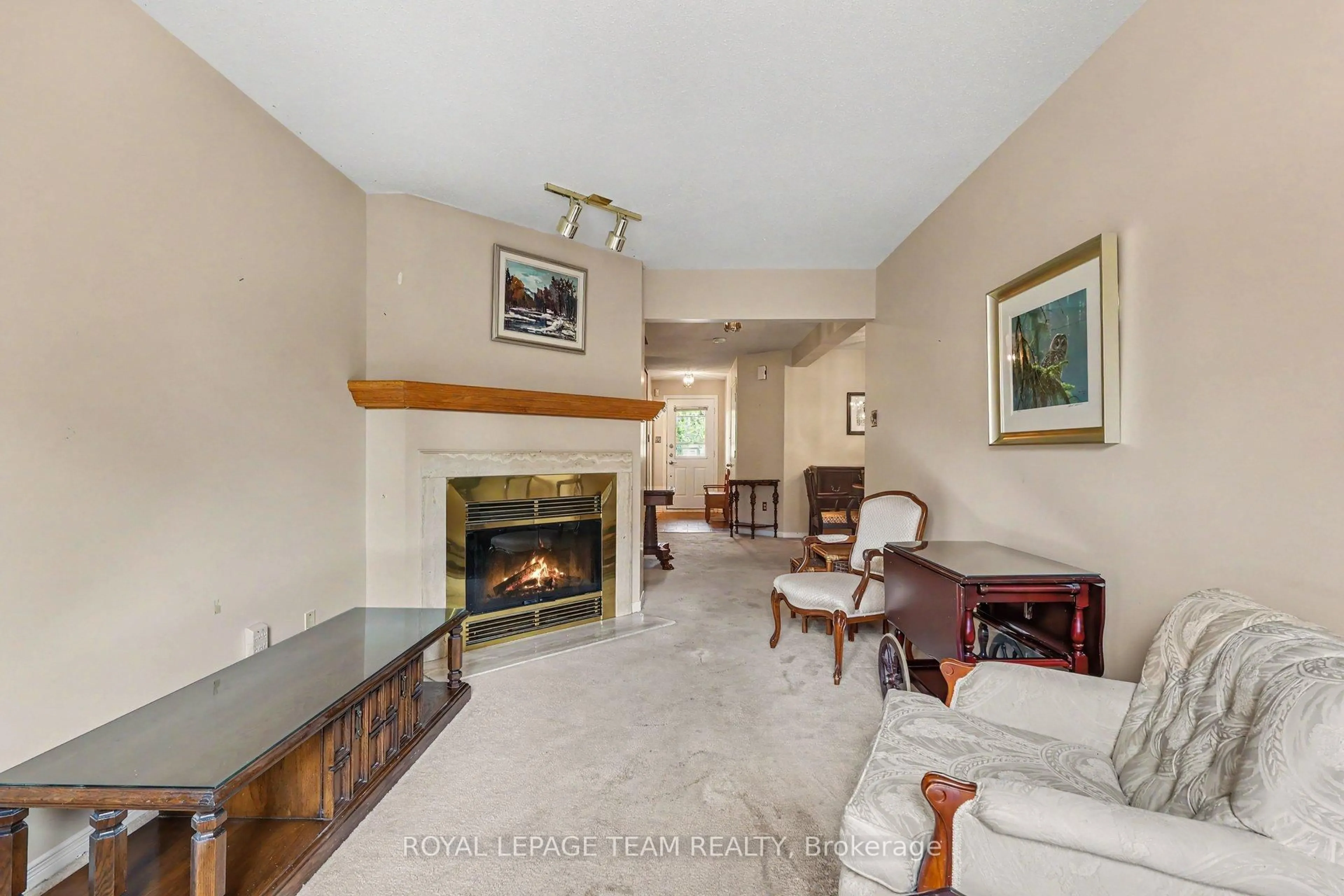 Living room with furniture, ceramic/tile floor for 36 Southport Dr, Ottawa Ontario K1T 3E7