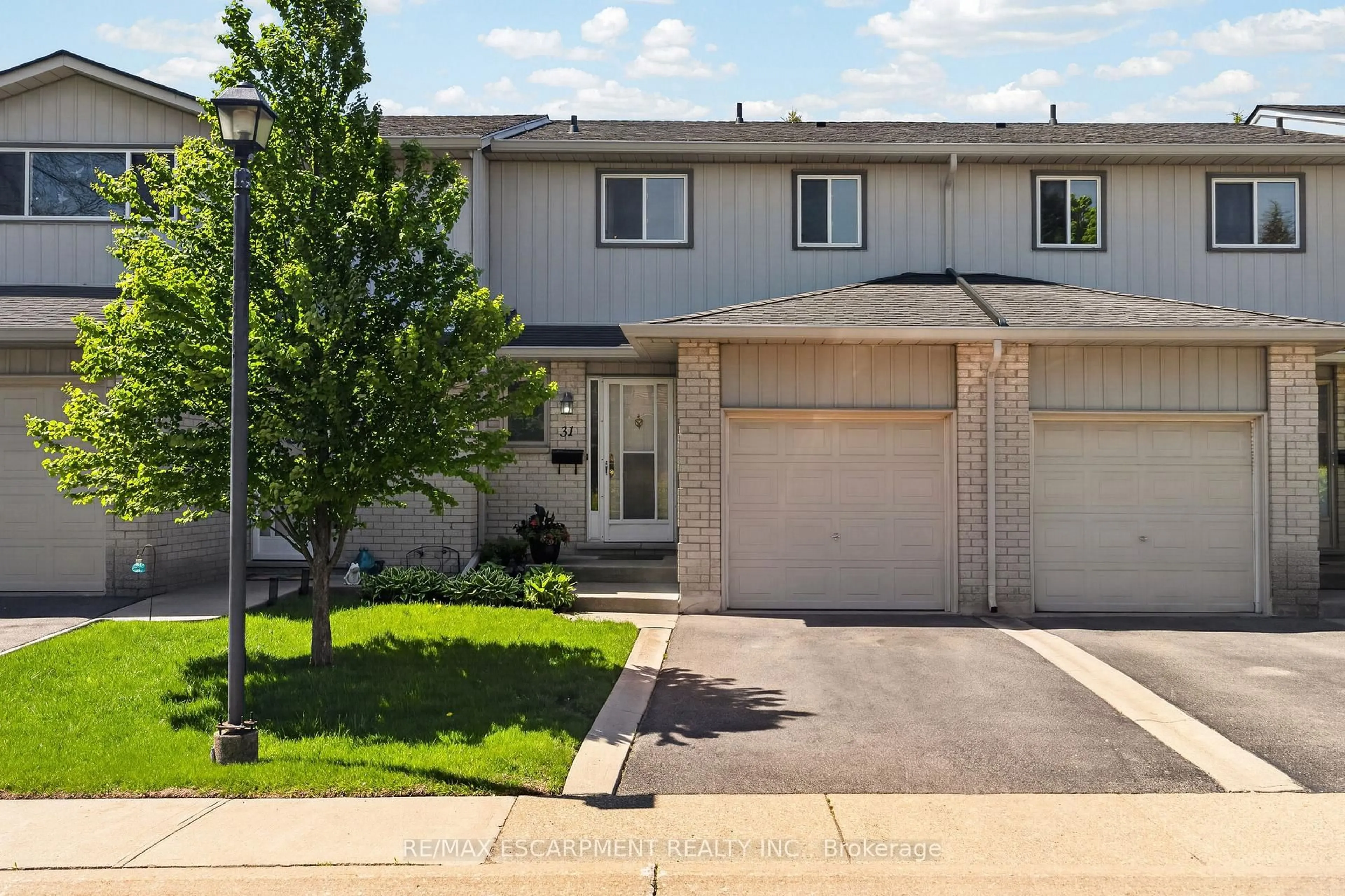 Home with vinyl exterior material, street for 1675 Upper Gage Ave #31, Hamilton Ontario L8W 3R8