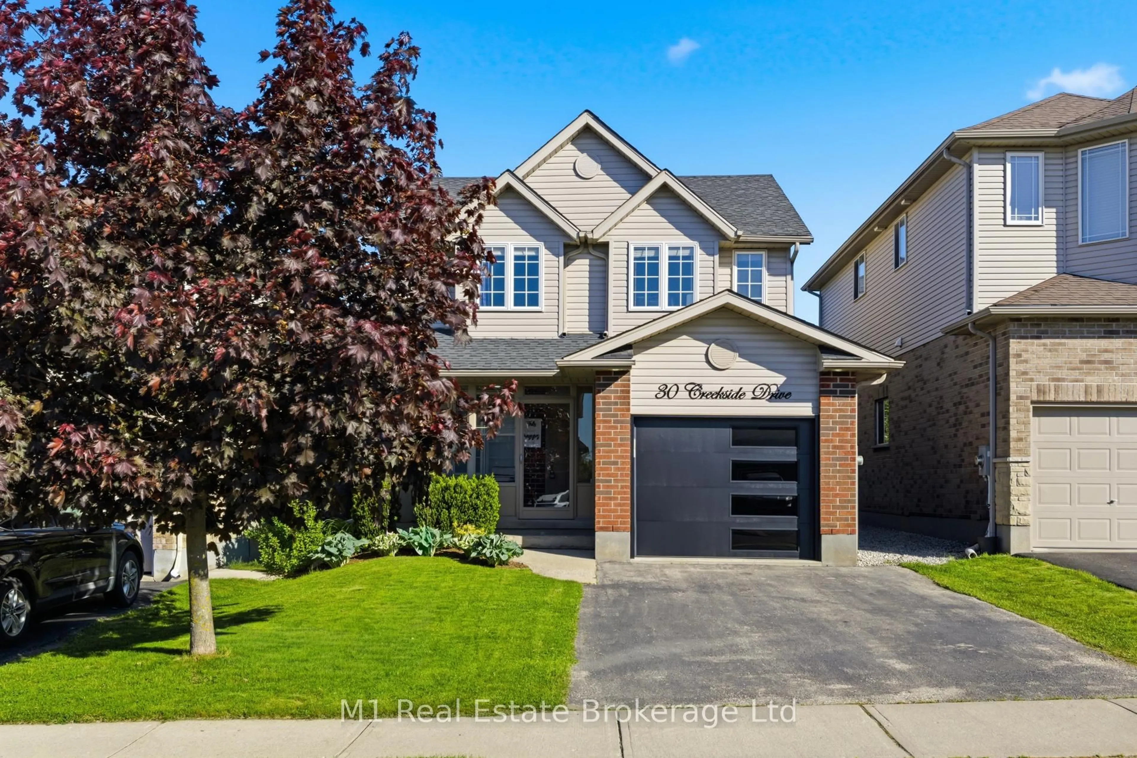 Home with brick exterior material, street for 30 Creekside Dr, Guelph Ontario N1E 0C2