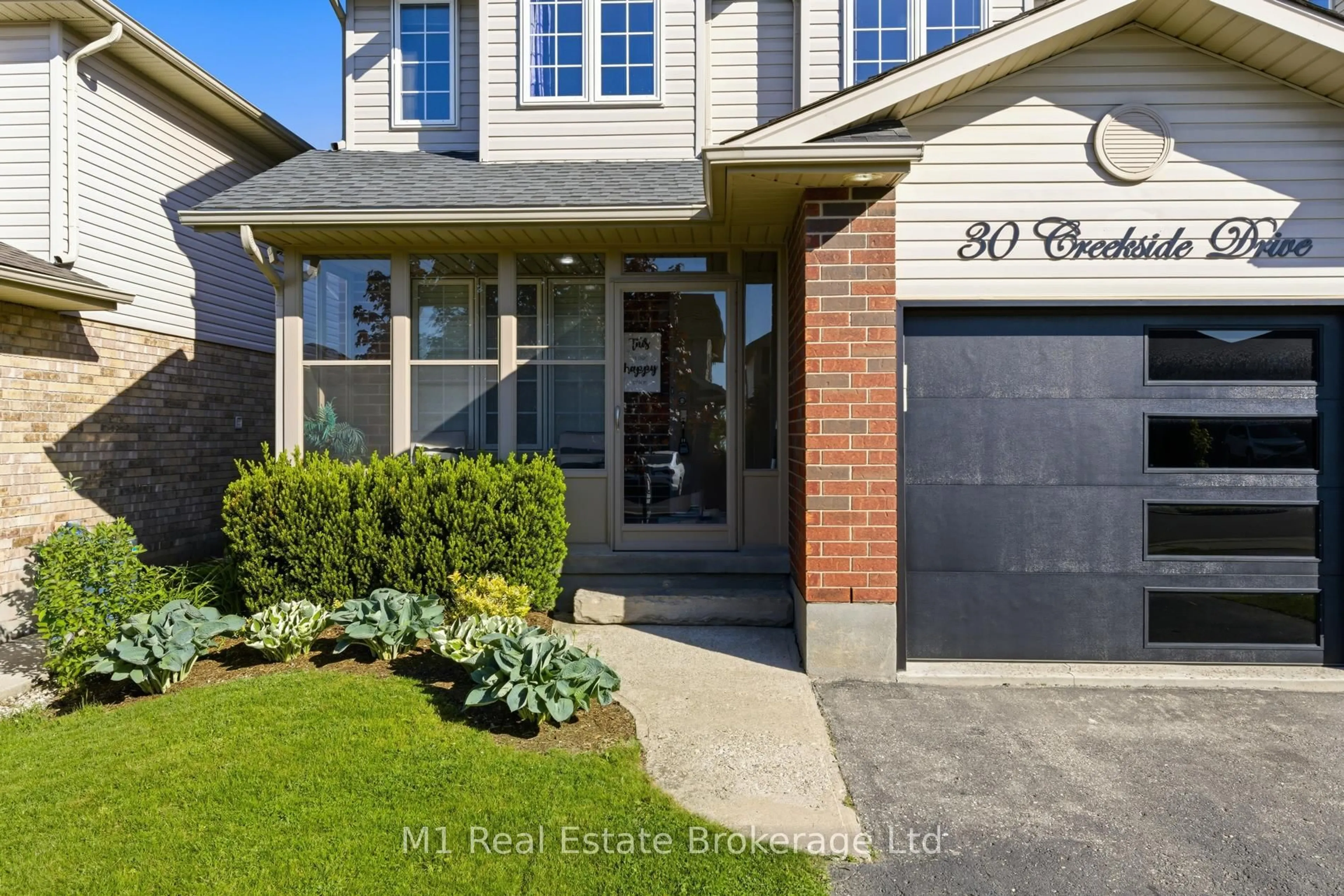 Home with brick exterior material, street for 30 Creekside Dr, Guelph Ontario N1E 0C2