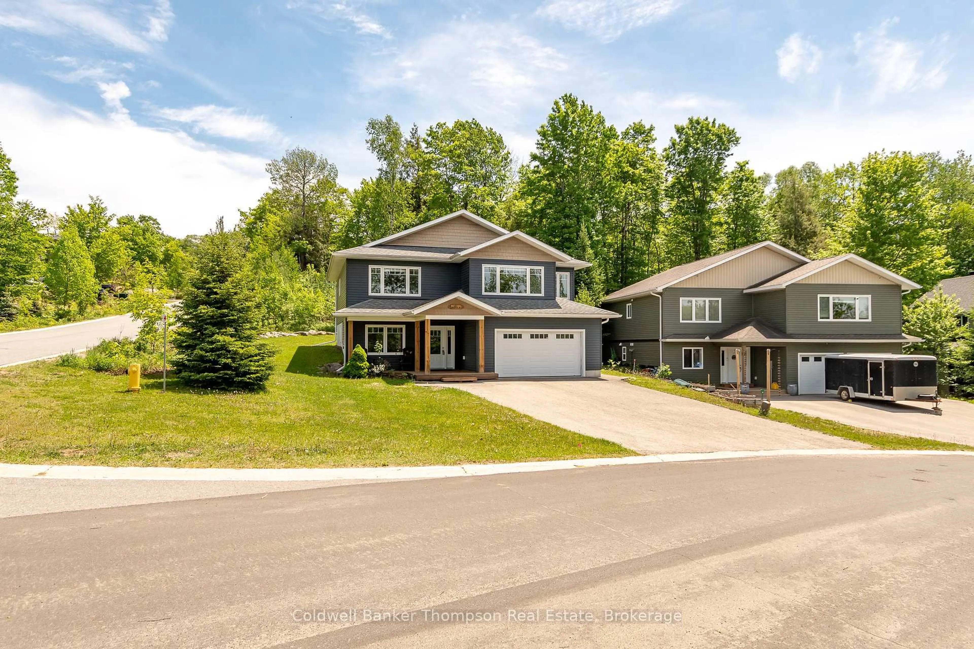 Home with vinyl exterior material, street for 20 Goodwin Dr, Huntsville Ontario P1H 2R3