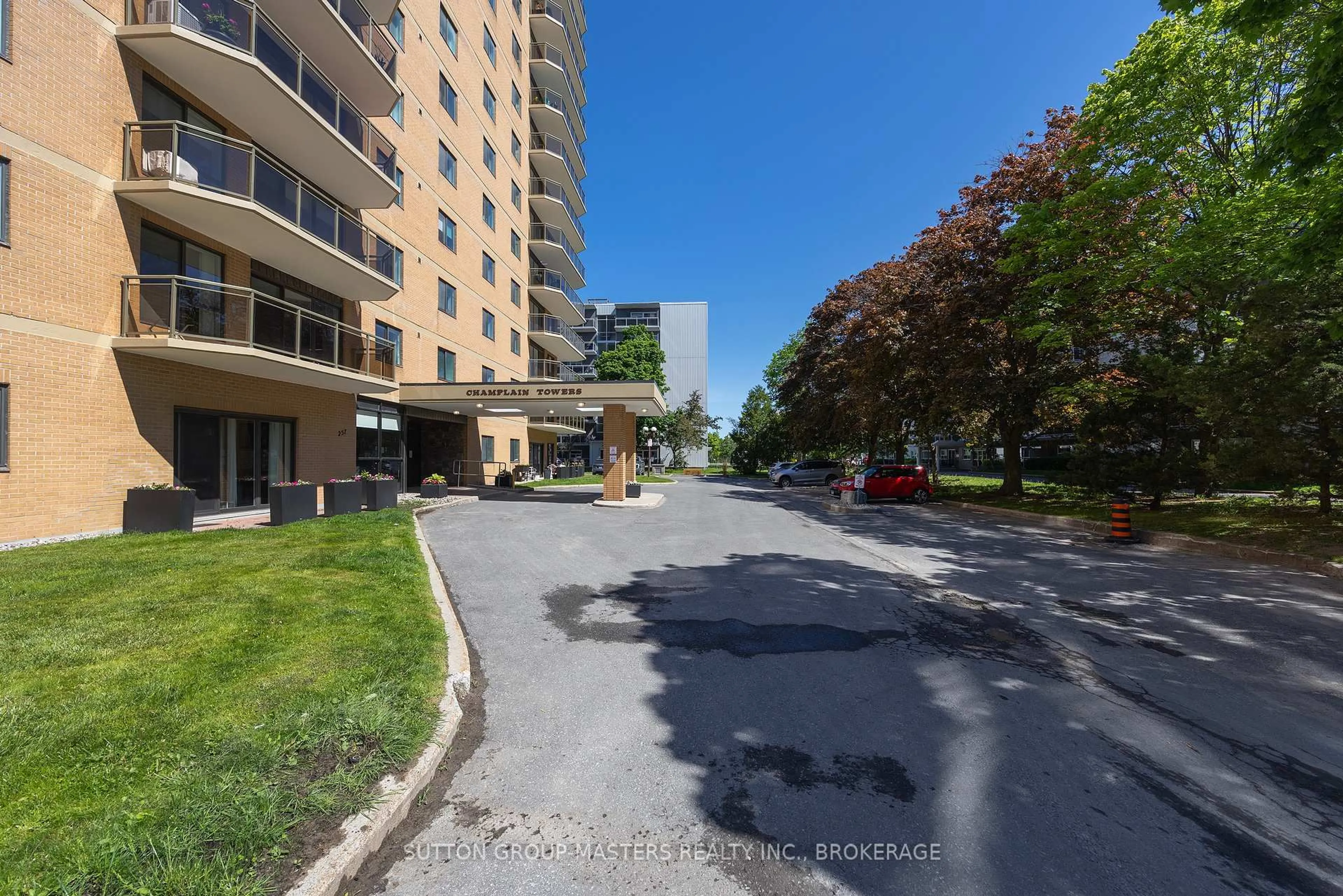 A pic from outside/outdoor area/front of a property/back of a property/a pic from drone, street for 257 Bath Rd #102, Kingston Ontario K7M 7T3