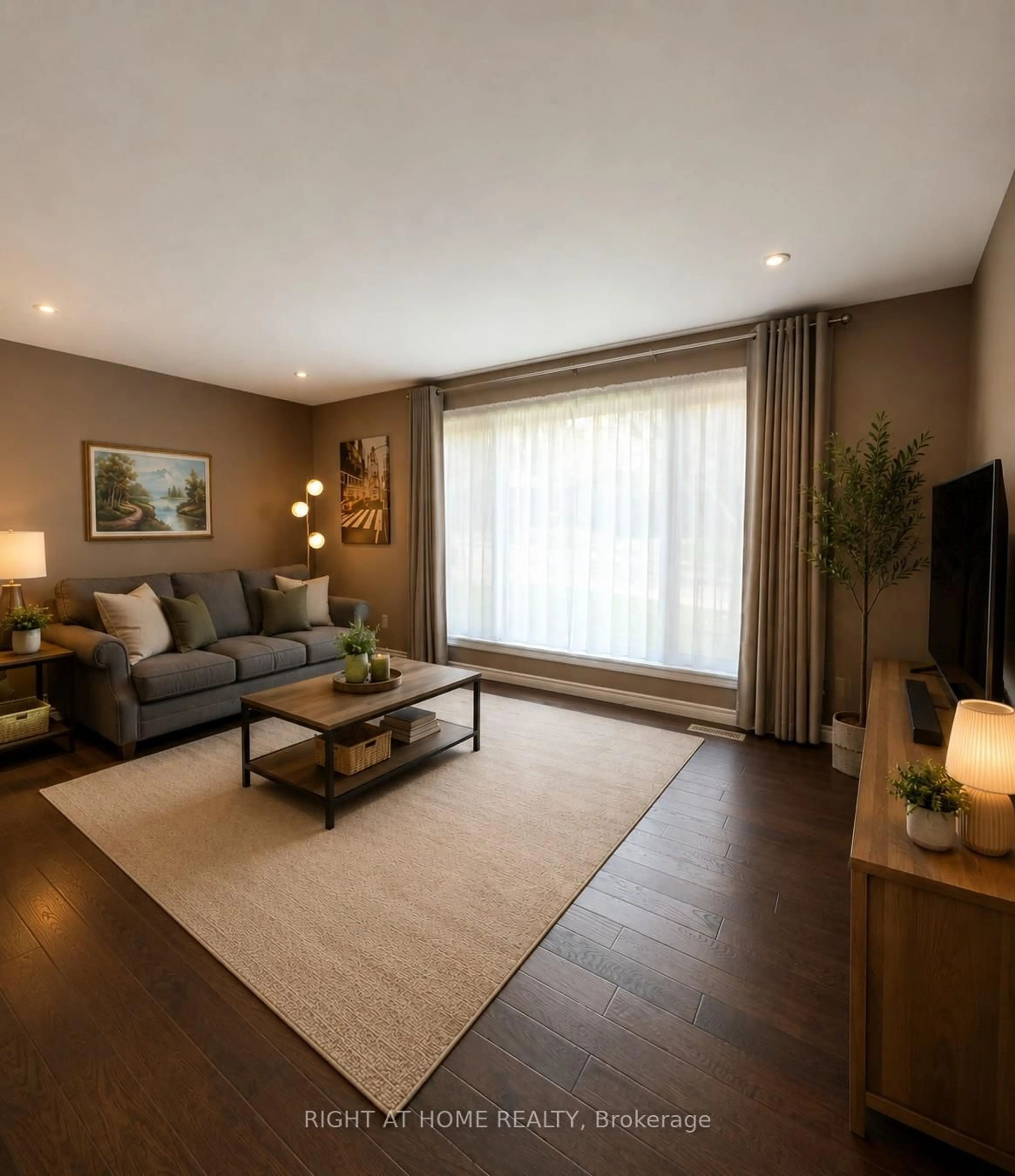 Living room with furniture, wood/laminate floor for 82 Blackwood Cres, Hamilton Ontario L8S 3H5