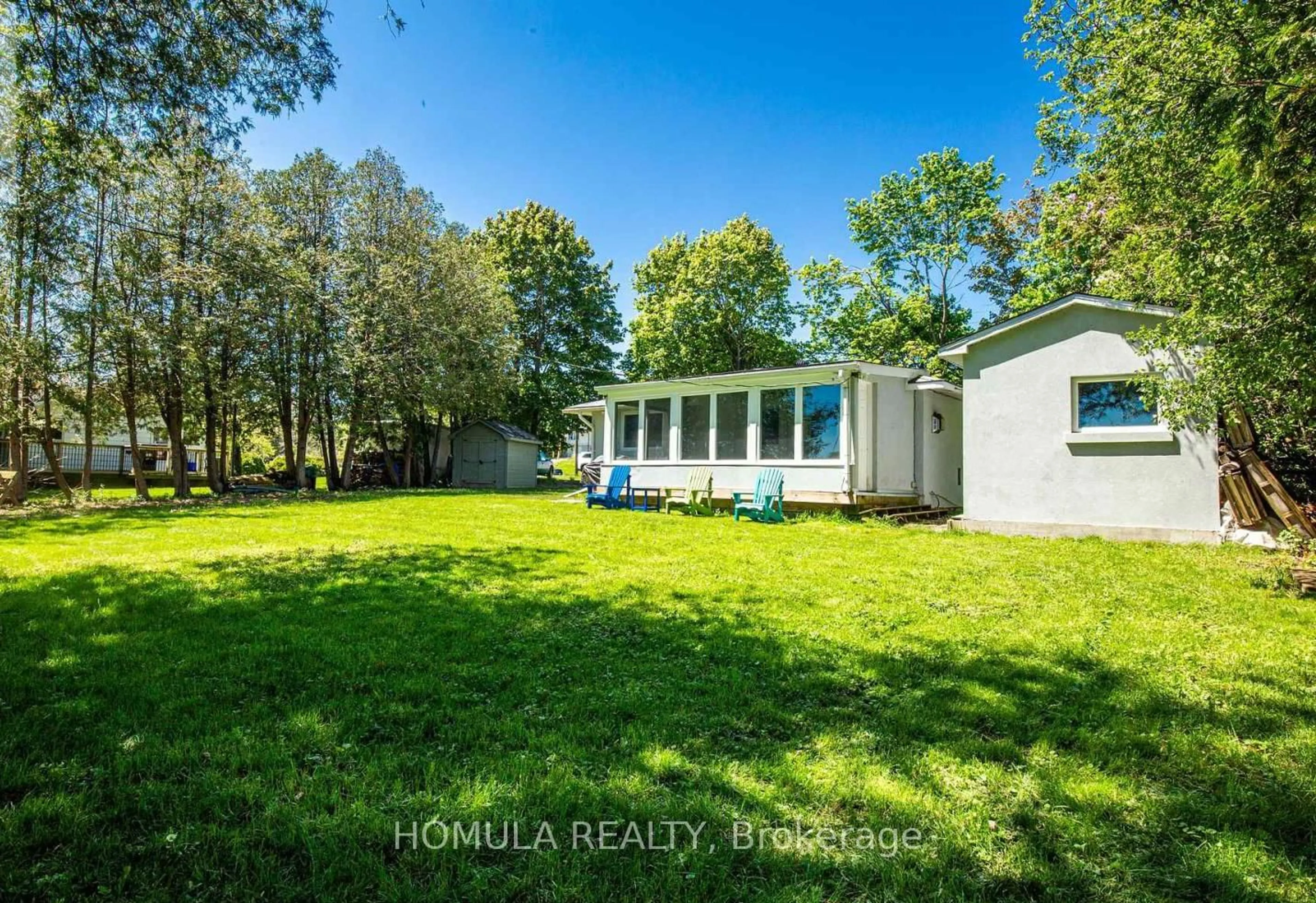 A pic from outside/outdoor area/front of a property/back of a property/a pic from drone, water/lake/river/ocean view for 24 Riverside Dr, Kawartha Lakes Ontario K9V 0H6
