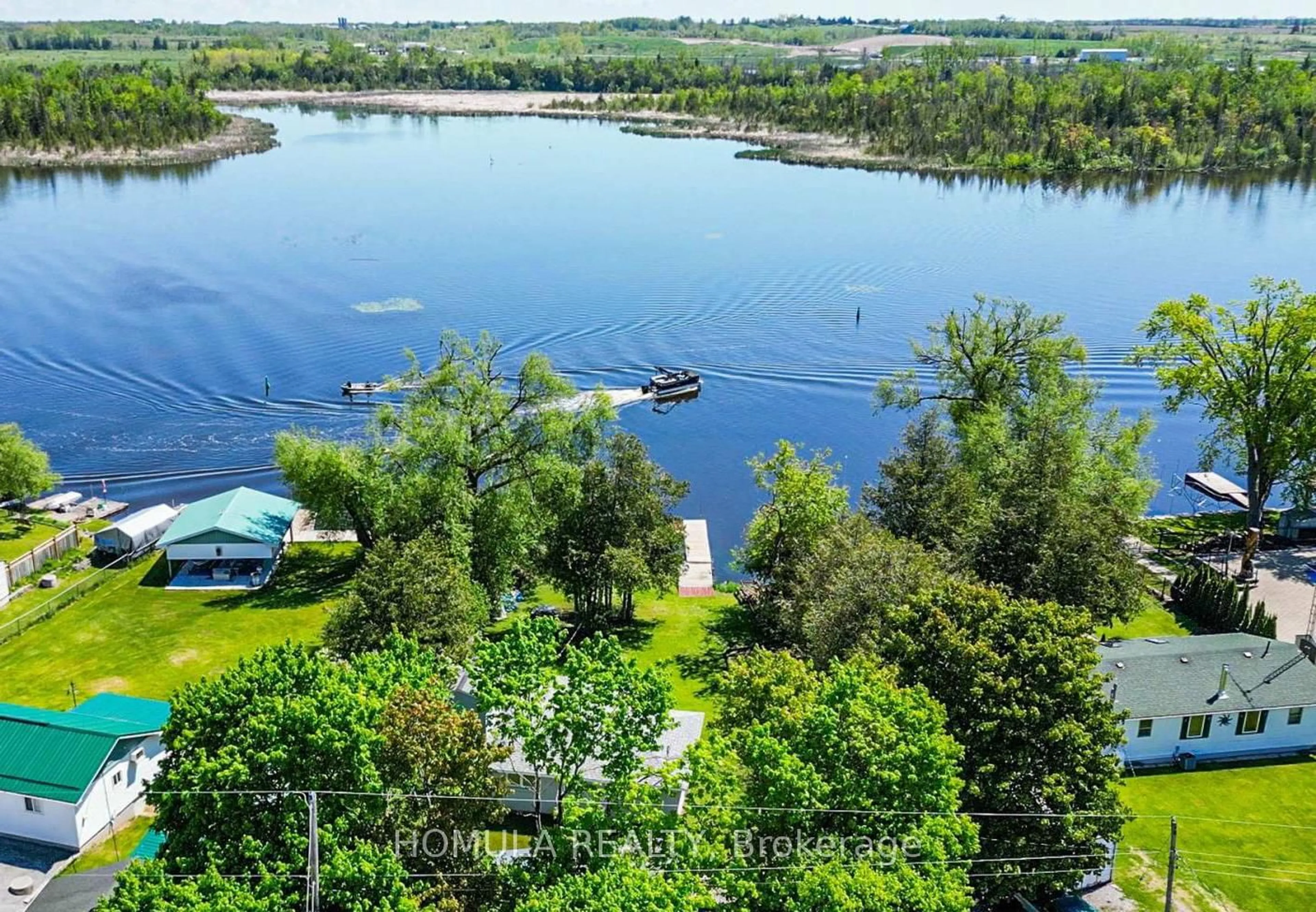 A pic from outside/outdoor area/front of a property/back of a property/a pic from drone, water/lake/river/ocean view for 24 Riverside Dr, Kawartha Lakes Ontario K9V 0H6