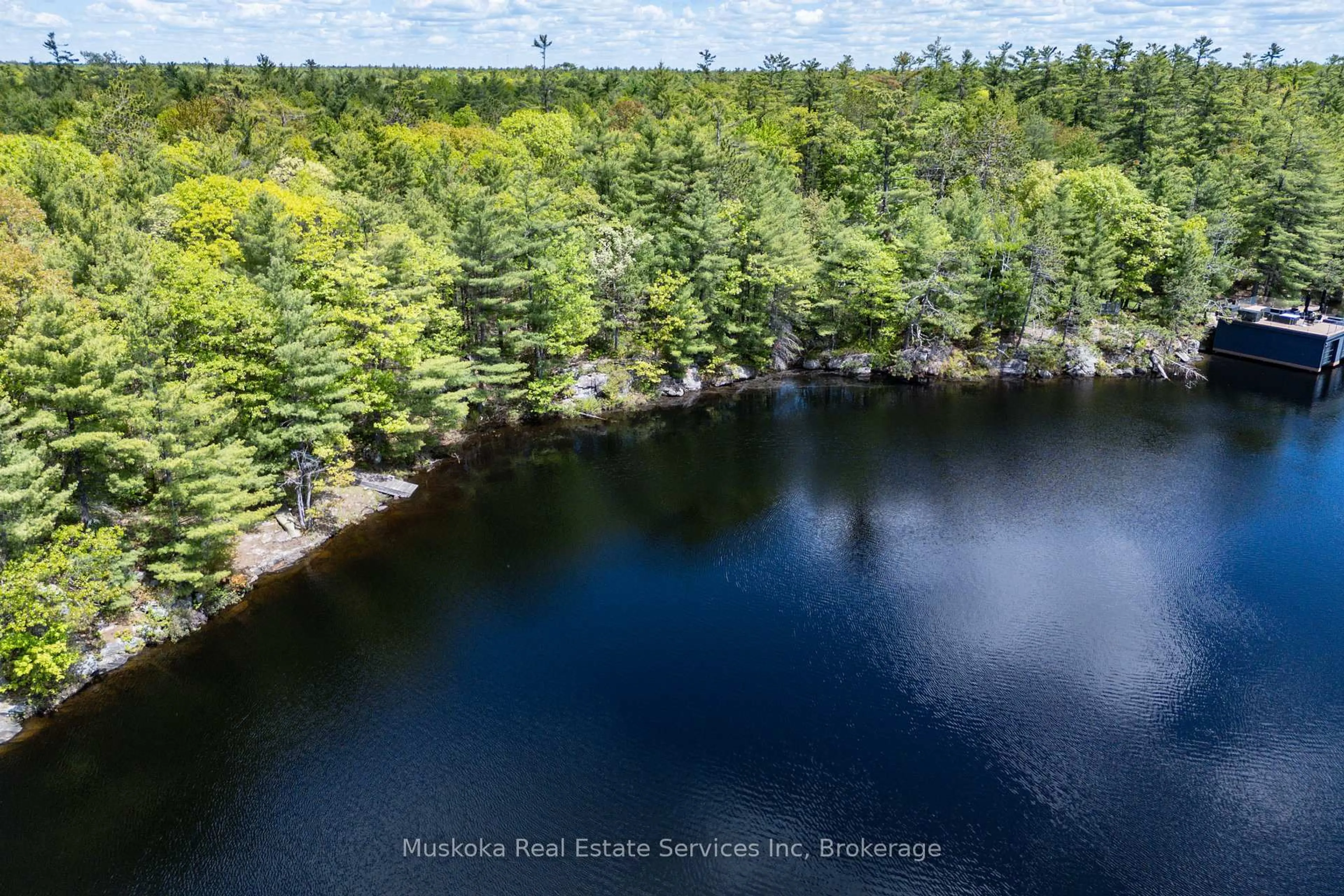 A pic from outside/outdoor area/front of a property/back of a property/a pic from drone, water/lake/river/ocean view for 1430 Kahshe Lake Rd, Gravenhurst Ontario P0E 1G0