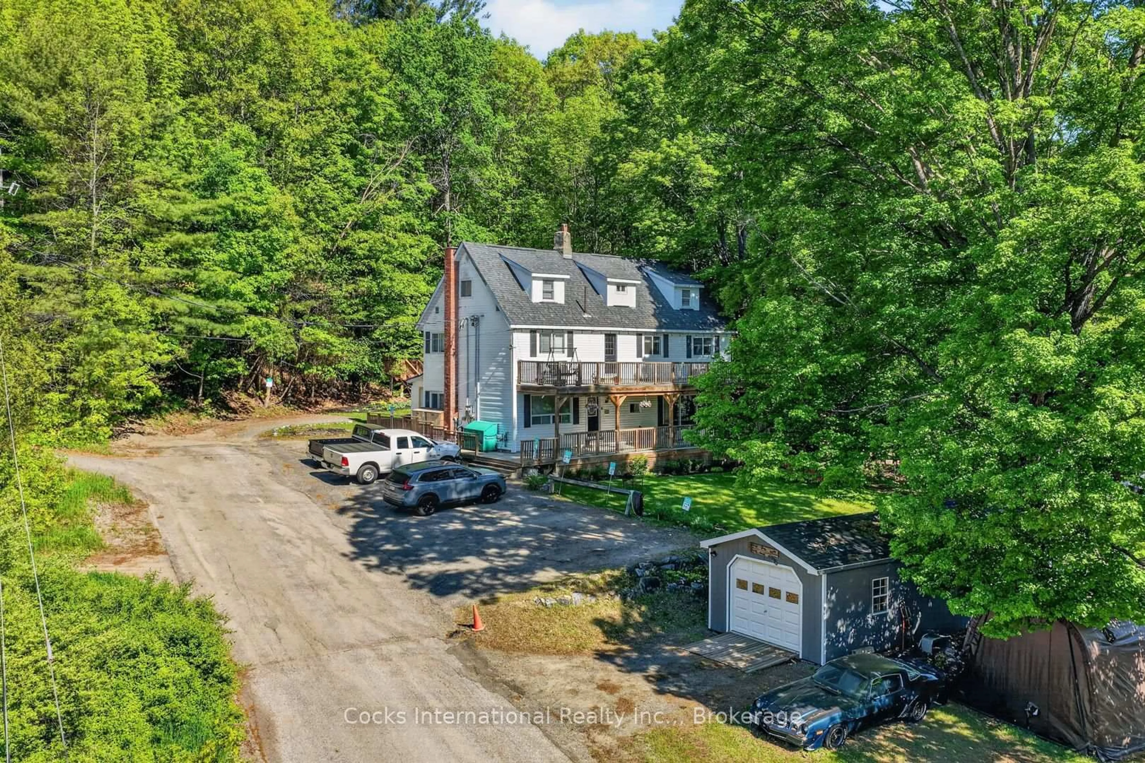 A pic from outside/outdoor area/front of a property/back of a property/a pic from drone, water/lake/river/ocean view for 755 Muskoka Road 10 Rd, Huntsville Ontario P0B 1L0