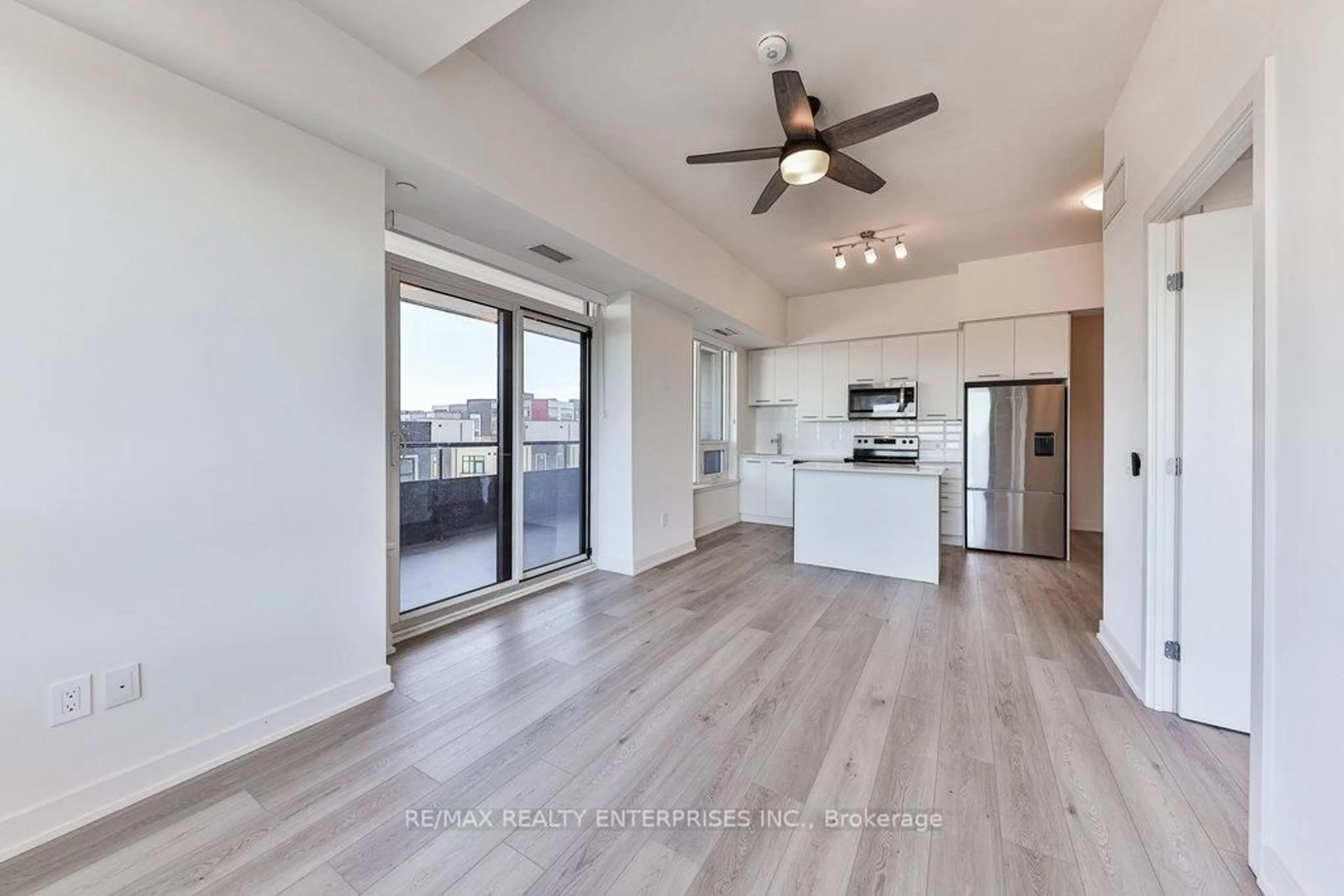 Open concept kitchen, wood/laminate floor for 385 Winston Rd #408, Grimsby Ontario L3M 0J3