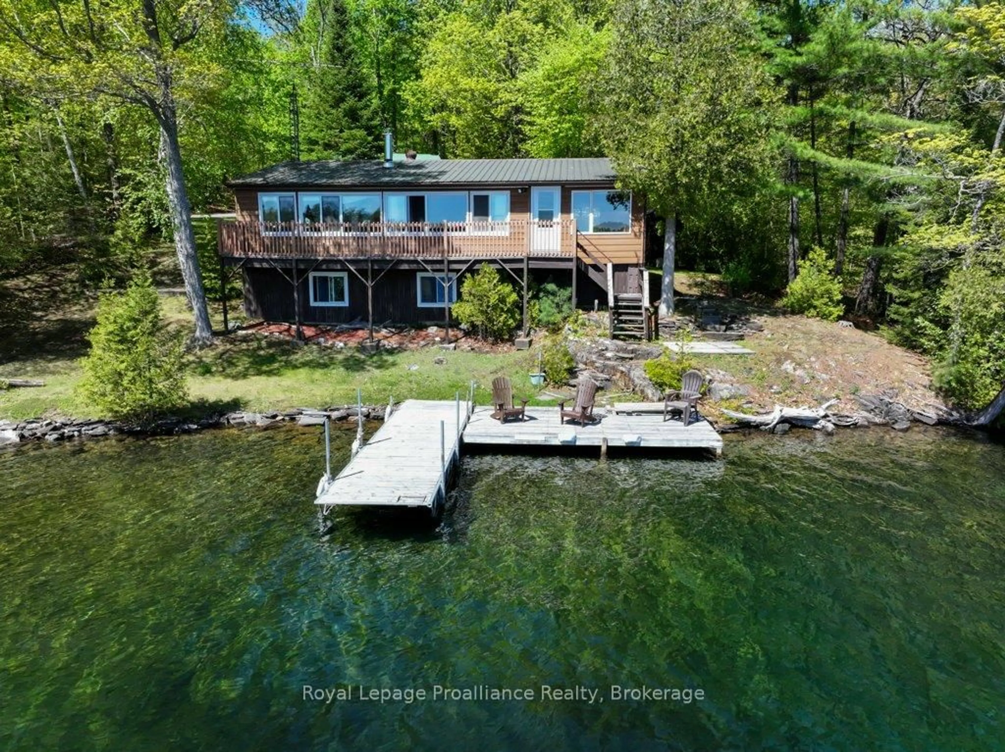 A pic from outside/outdoor area/front of a property/back of a property/a pic from drone, water/lake/river/ocean view for 1017 Bay Lane, Cloyne Ontario K0H 1K0